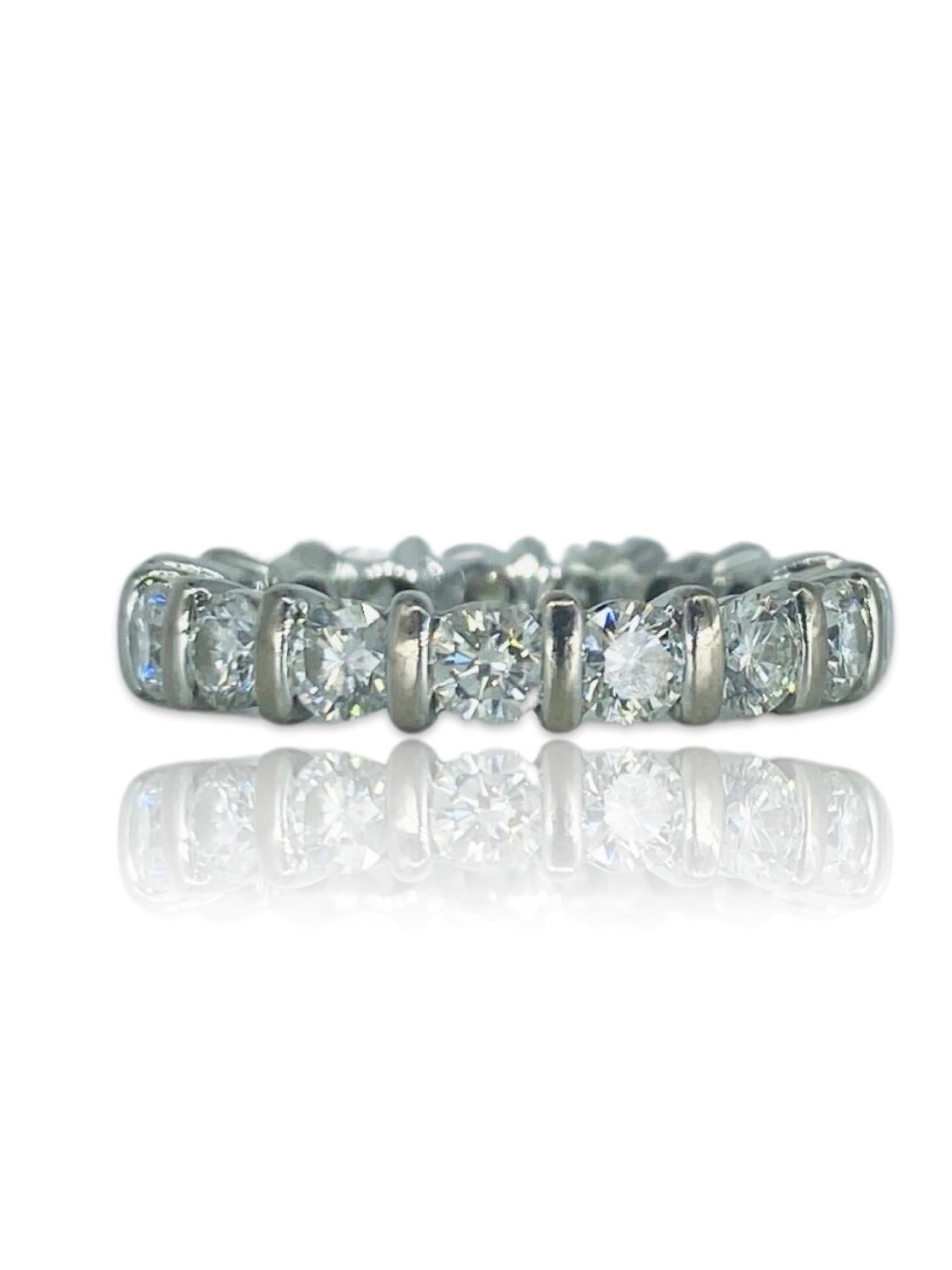 Vintage 2.04 Carat Round Diamonds Eternity Ring. The diamonds featured in the ring G-H/VS-SI round 0.12ct/each X 17 stones for a total of 2.04tcw (by formula). The ring is made of 18k white gold and is a size 5.25 (not sizeable). The total weight of