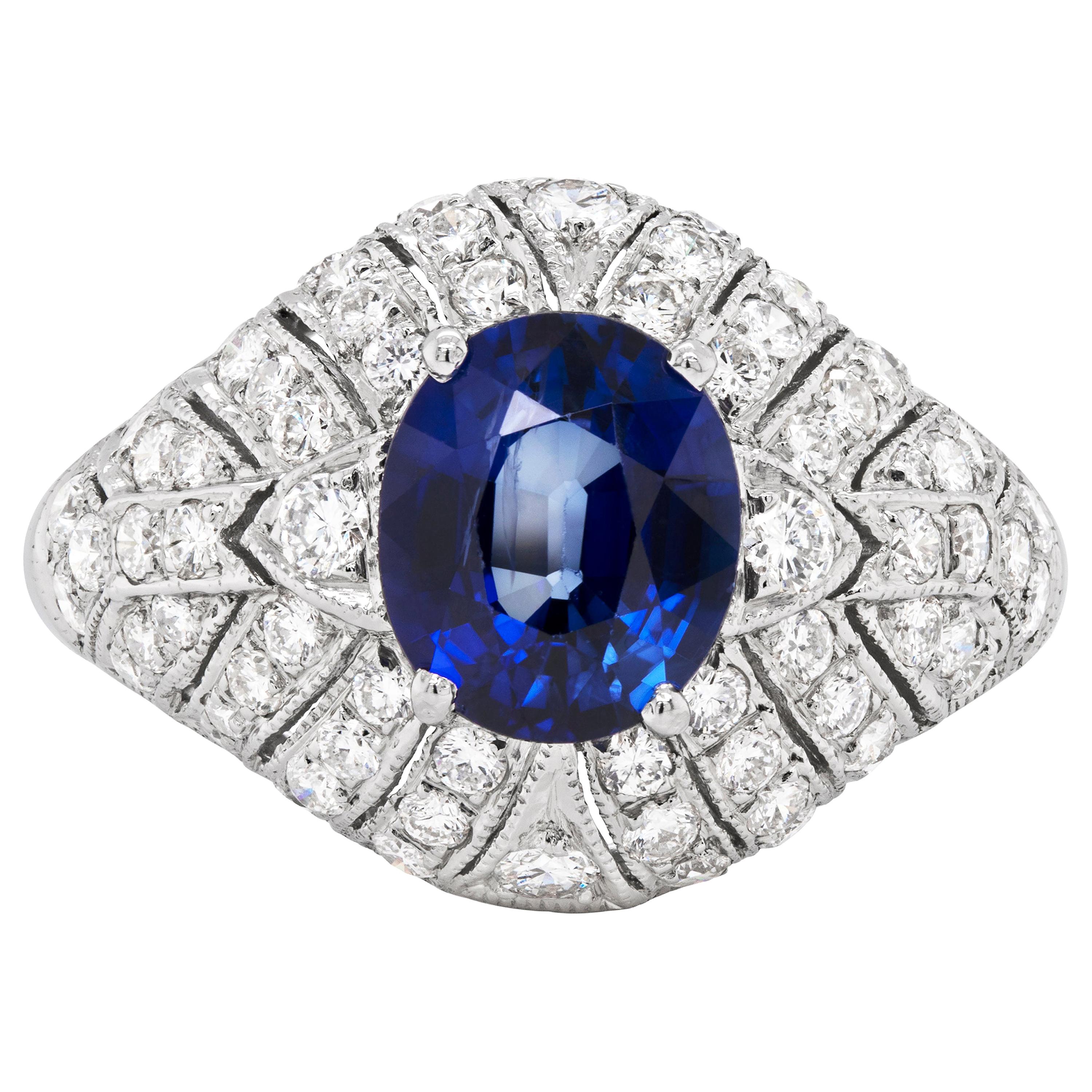 Vintage 2.06 Carat Oval Sapphire and Diamond Cluster Platinum Engagement Ring