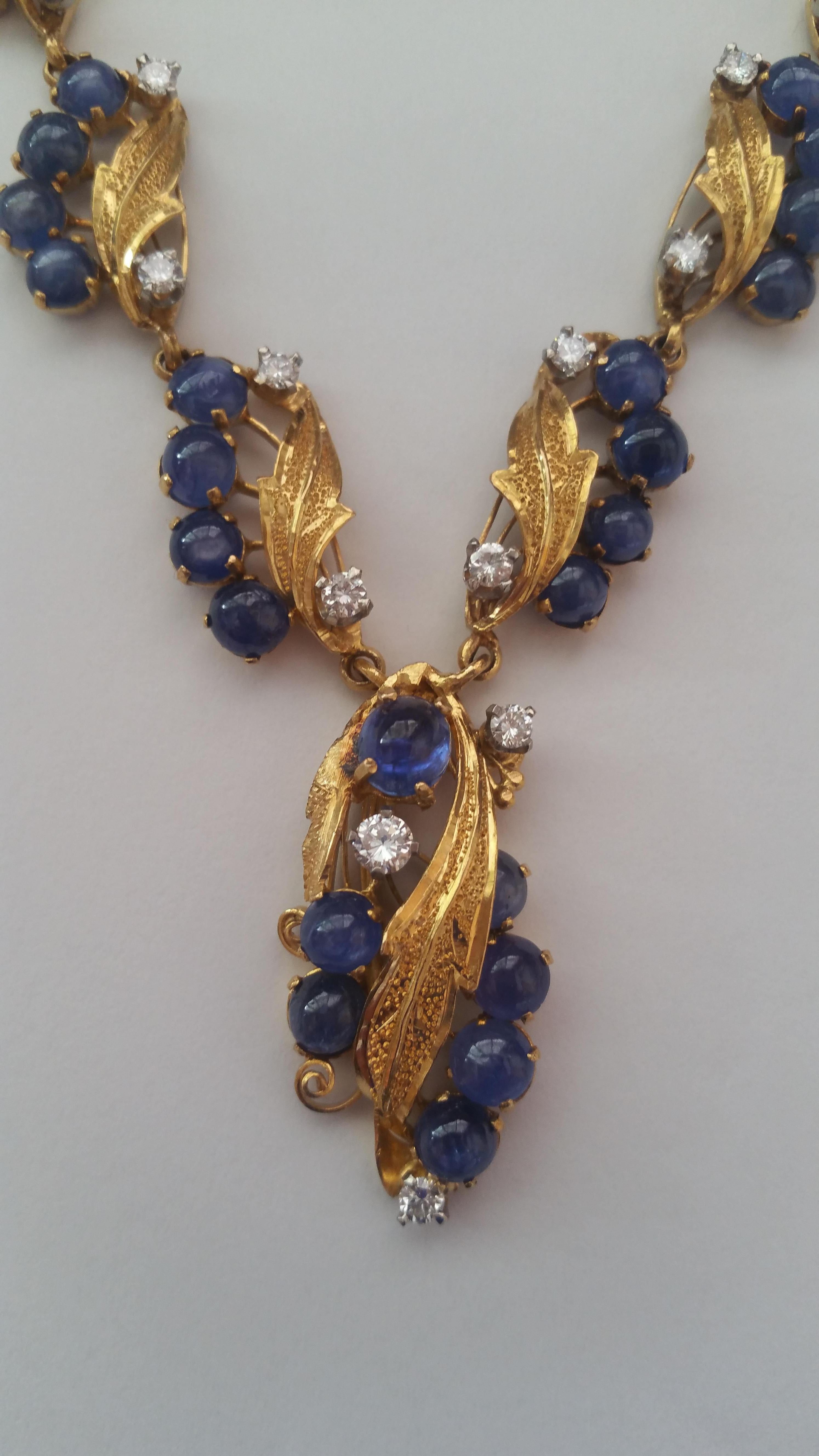 Vintage 20kt Yellow Gold, Sapphire, Diamond Necklace Cabochon Sapphires of 13.53 cttw, Diamonds of 1.67 cttw 18 inches plus dangle

Statement necklace with fine leaf detail featuring fine blue cabochon sapphires of 13.53cttw and round brilliant