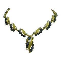 Collier vintage en or jaune 20 carats, saphir cabochon 13,53 carats, diamants 1,77 carat 