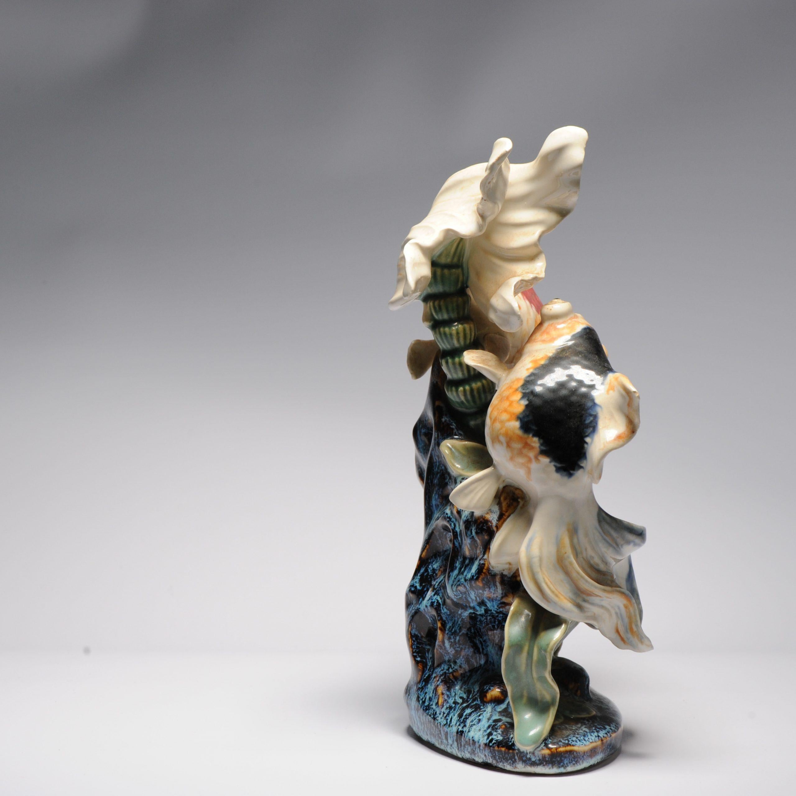 gold fish statue