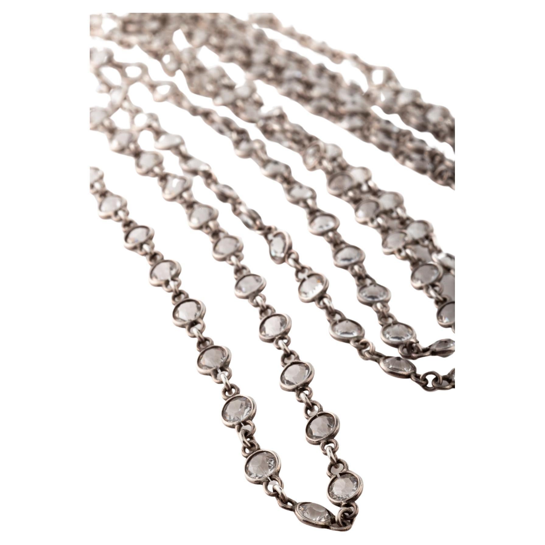 Faceted white topaz fills this chain with little space between the stones. The length is wonderful. It can be wrapped around the body twice or divided into two chains. The links and settings and clasp are strong sterling silver. I often use these