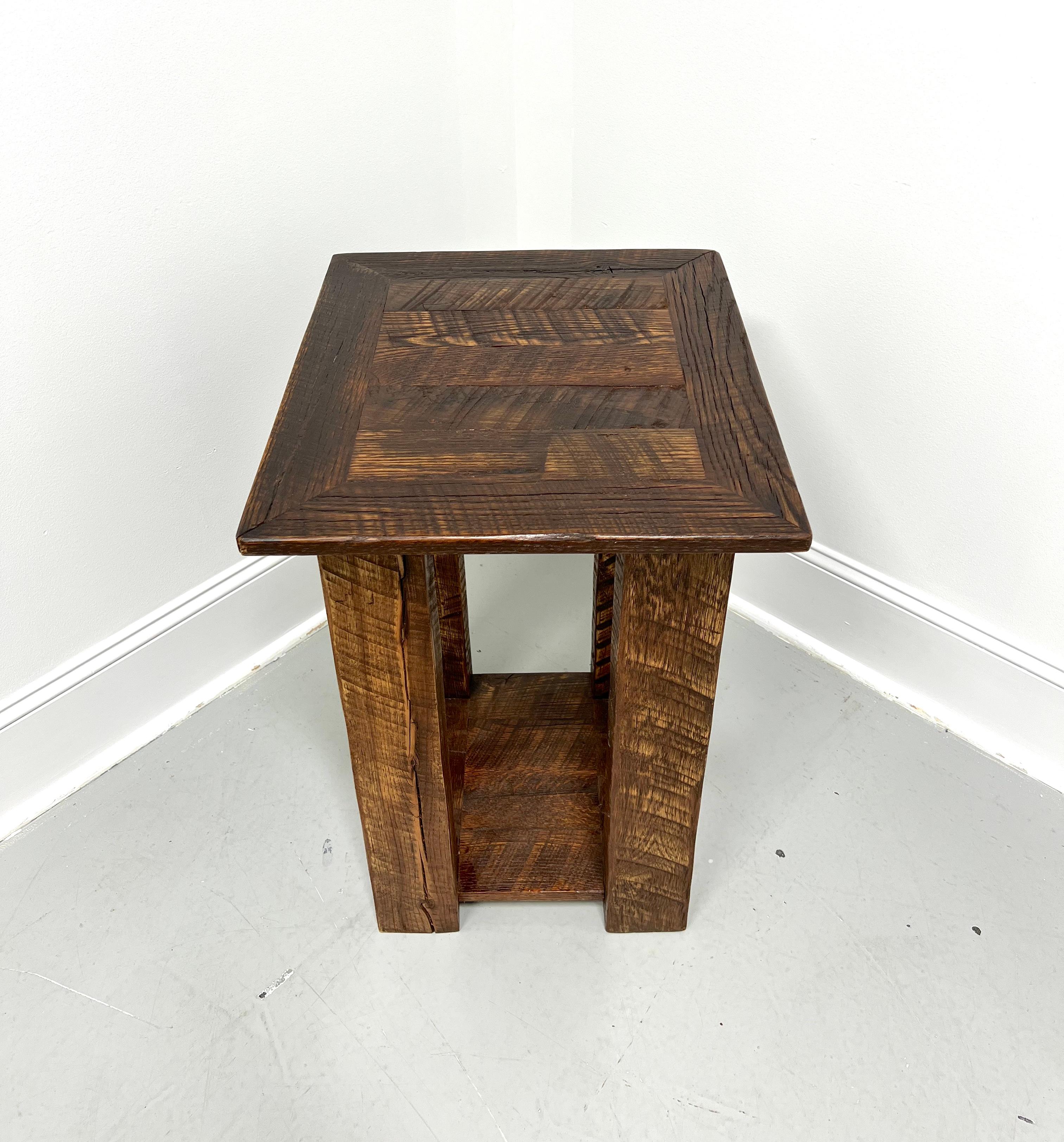 A Rustic style benchmade accent table, unbranded. Solid oak, banded plank top with squared edge, undertier shelf, and solid square straight legs. Made in the USA, in the mid 20th Century.

Measures: 21w 18d 27h

Exceptionally good vintage condition