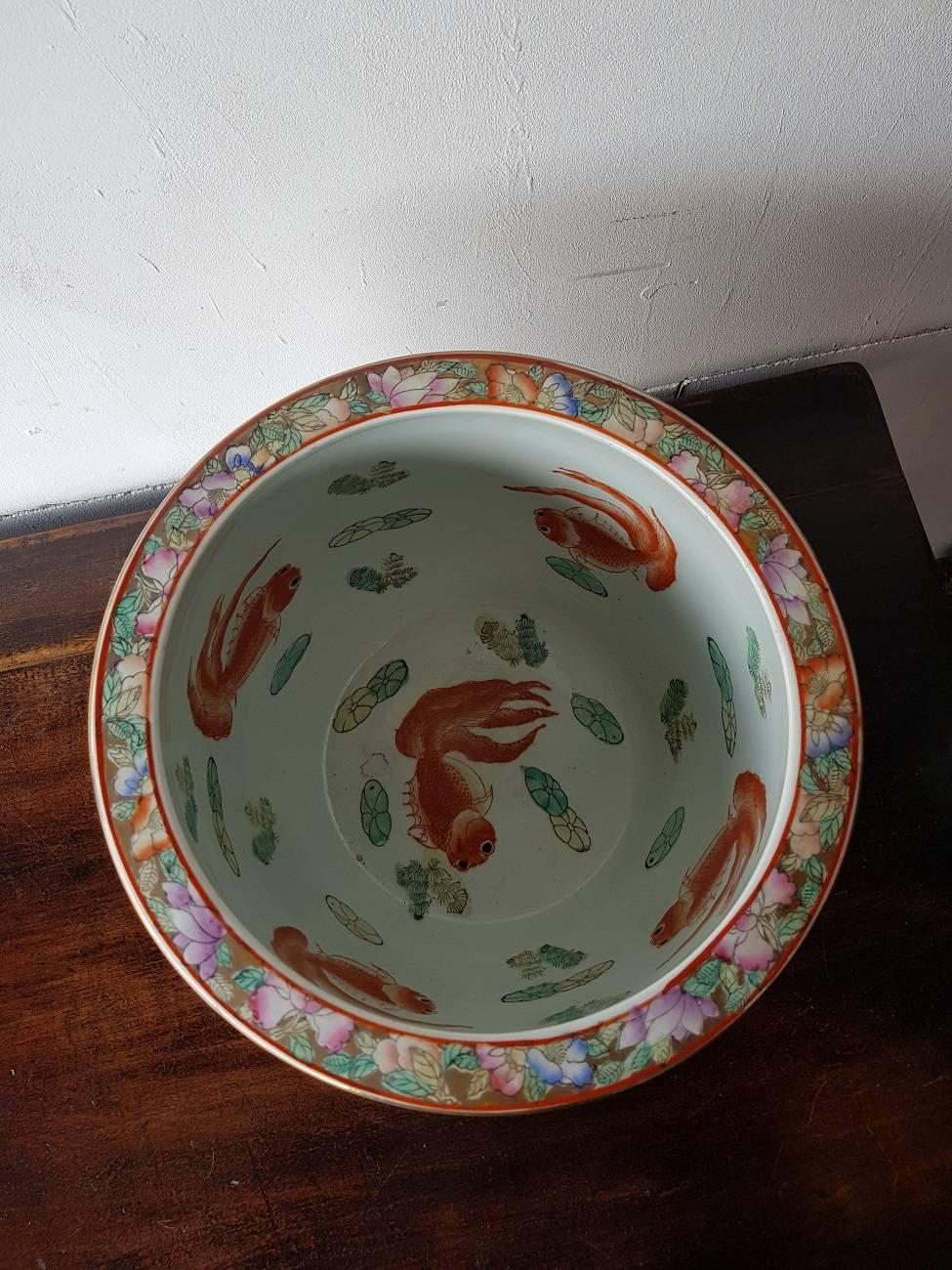 Fantastic and colorful Chinese porcelain fishbowl after a antique example with images of women and further in mint condition and made in the Second half of the 20th century.

The measurements are,
Depth 30.5 cm/ 12 inch.
Width 30.5 cm/ 12