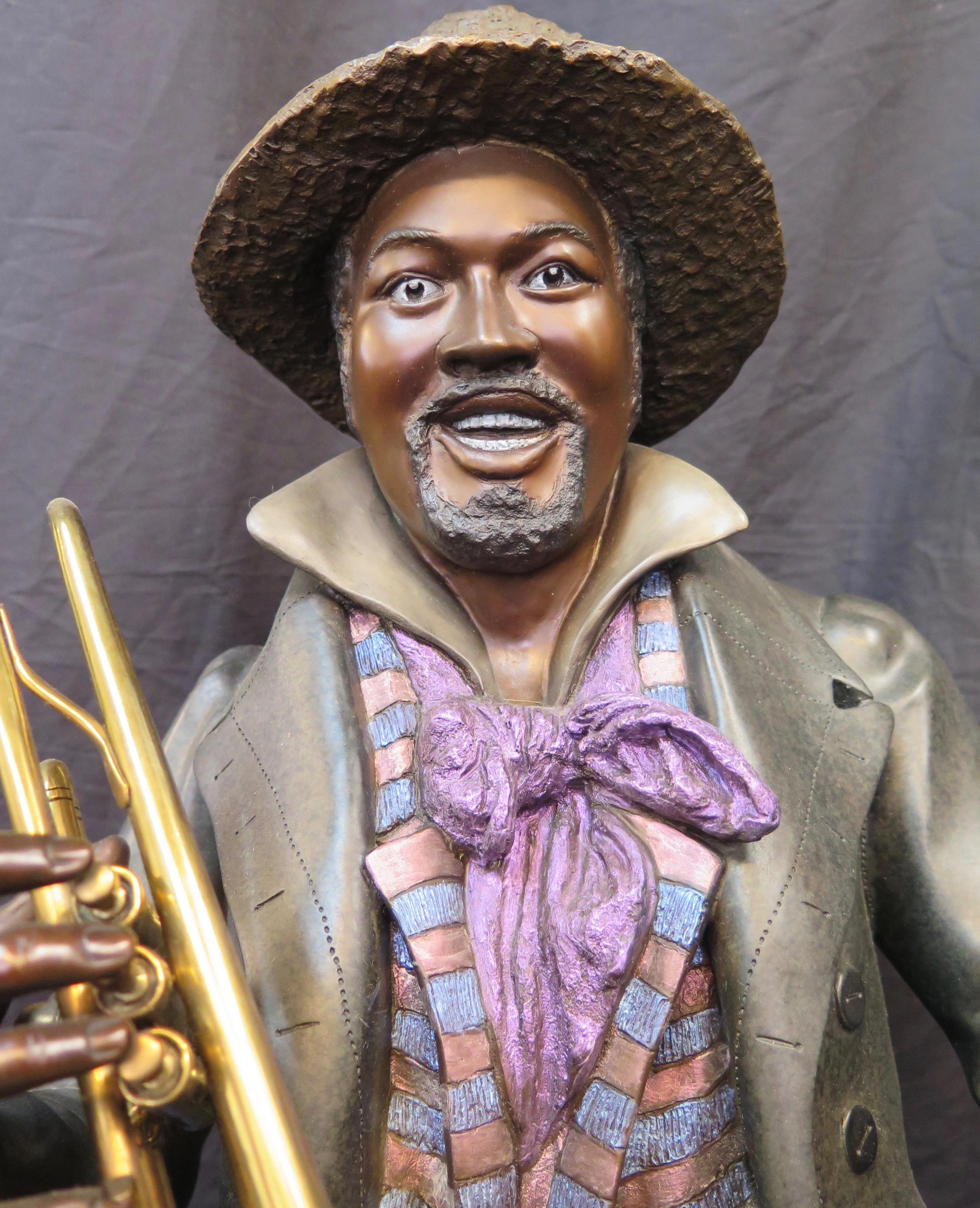 This 20th century cold painted bronze depicts an American black jazz musician playing trumpet. It is signed 