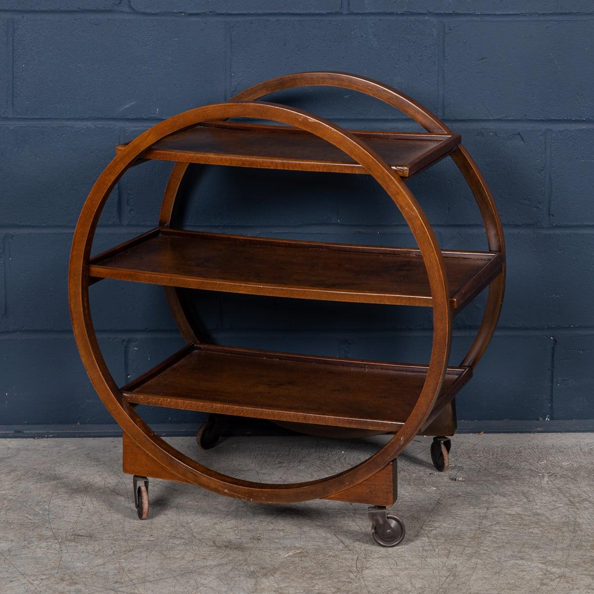 An attractive and iconic English Art Deco trolley cart dating from the 1920s-1930s. Embodying the elegance and functionality of the era and crafted from solid walnut with a warm mid-tone finish, this three-tiered trolley exudes timeless charm while