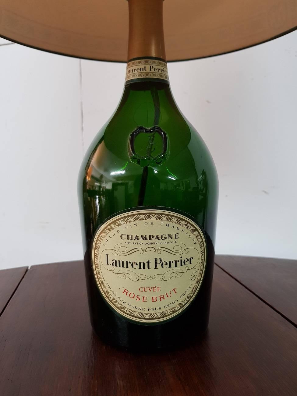 Vintage Champagne bottle table lamp of Laurent Perrier from the 20th century.

The measurements are,
Depth 40 cm/ 15.7 inch.
Width 40 cm/ 15.7 inch.
Height 58 cm/ 22.8 inch.
 