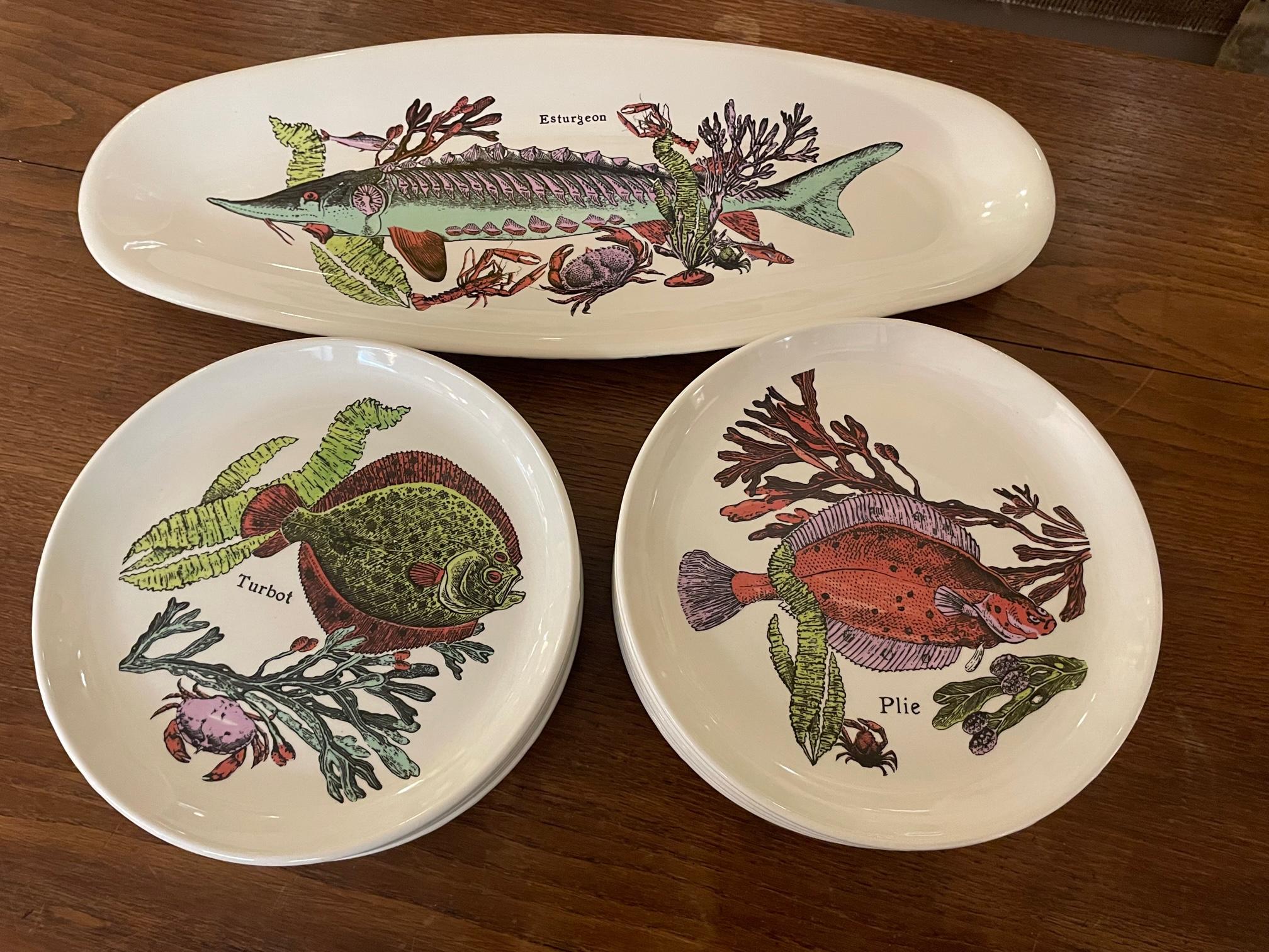 Rare Fish set from the 1970s made in the Sarreguemines Faiencerie in France. 
Twelve plates representing a species of fish, two species by plates and a large plater.  
