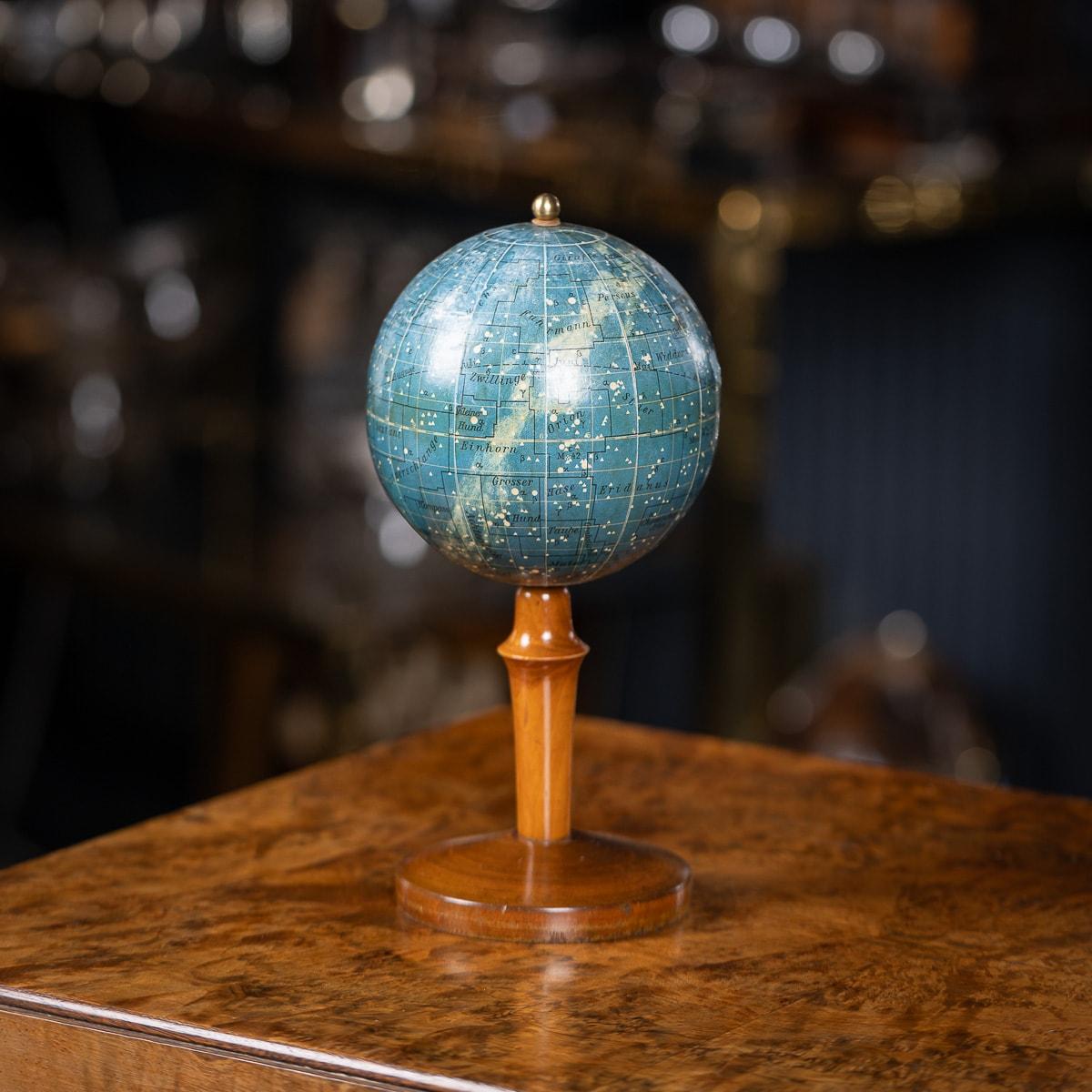 A superb 20th Century small celestial globe, made in Berlin by Dietrich Reimers. The globe is mounted on a turned wooden stand, attached with a metal axis. Featuring the array of stars, constellations, and various astronomical circles.

CONDITION
In