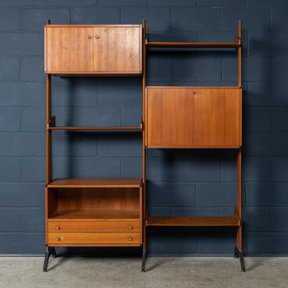 Introducing a wonderful piece of Italian design history, this is an exquisite mid-century modern bookcase from the 1960s. Crafted with attention to detail, this modular bookcase is made out of teak veneer and features three cabinets and three