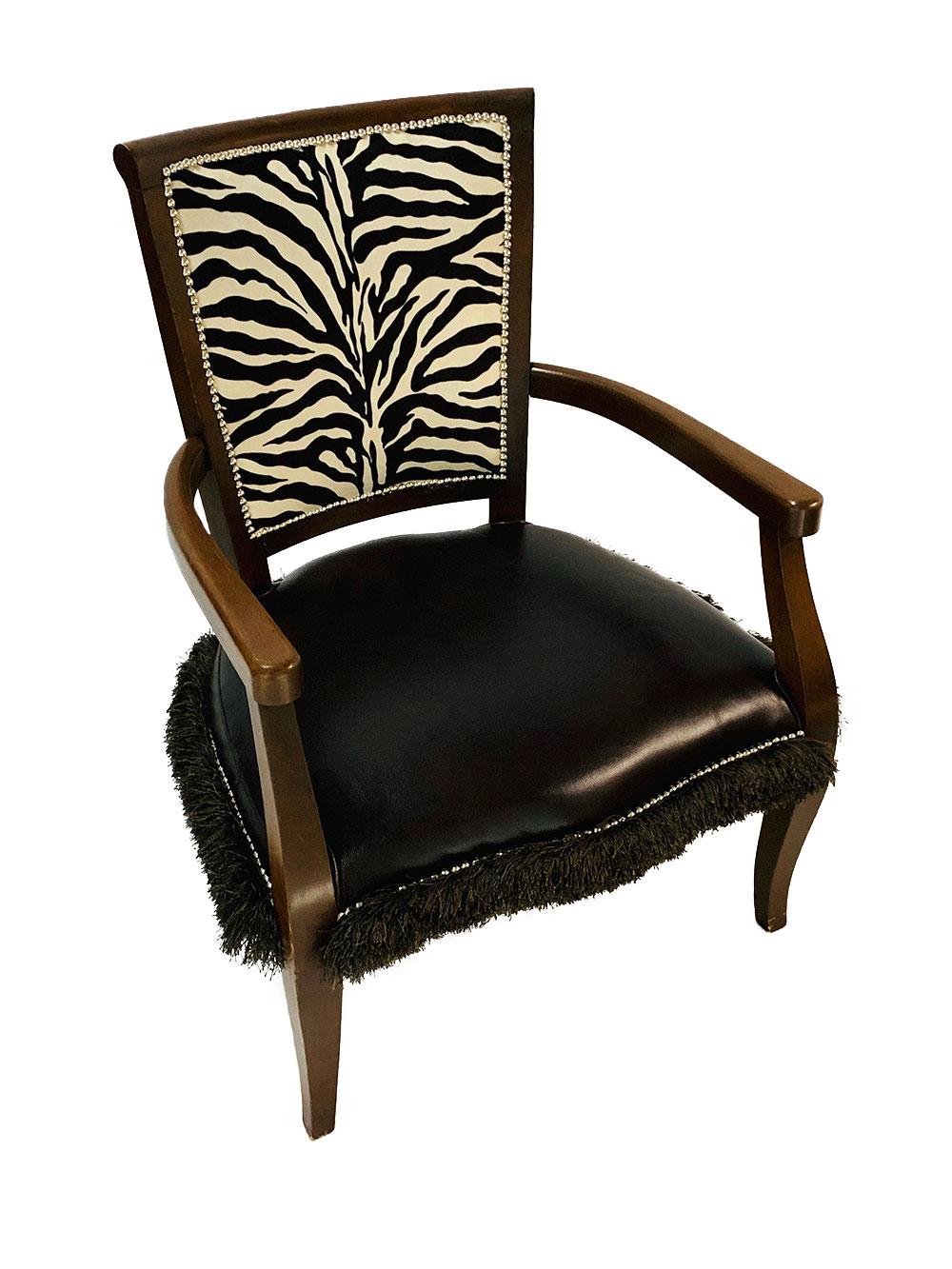 Vintage 20th century late, modern French style open armchair fully restored and reupholstered in brown and white zebra velour on the back and a seat covered in dark brown branded leather. Contemporary silver nailheads and brown brush fringe outline
