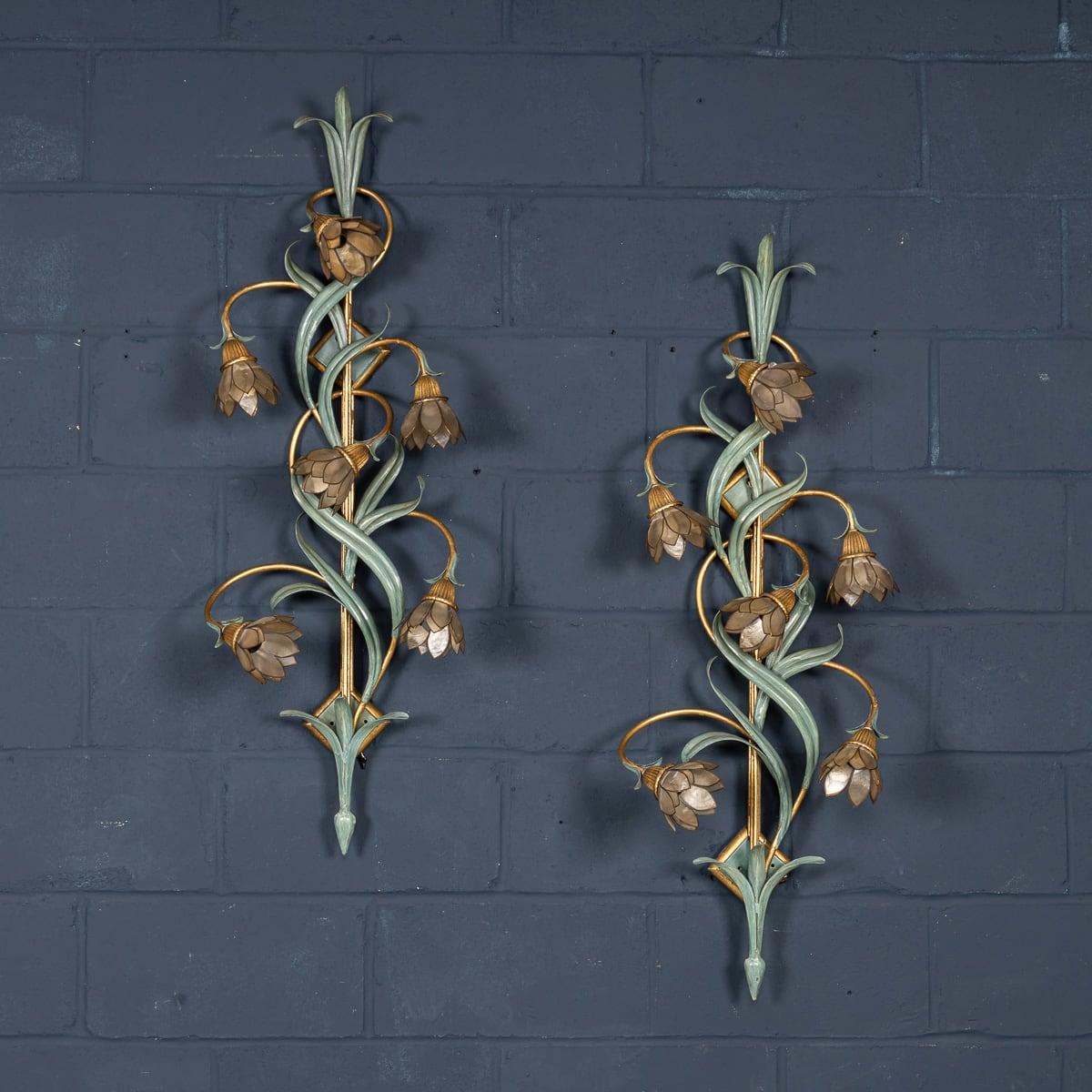 A stunning pair of 1970s wall sconces from the renowned Banci company. With wonderful elegance and artistry of Italian design, these lamps feature a striking metal body crafted from wrought iron and hand-painted. Each wall sconce is adorned with six