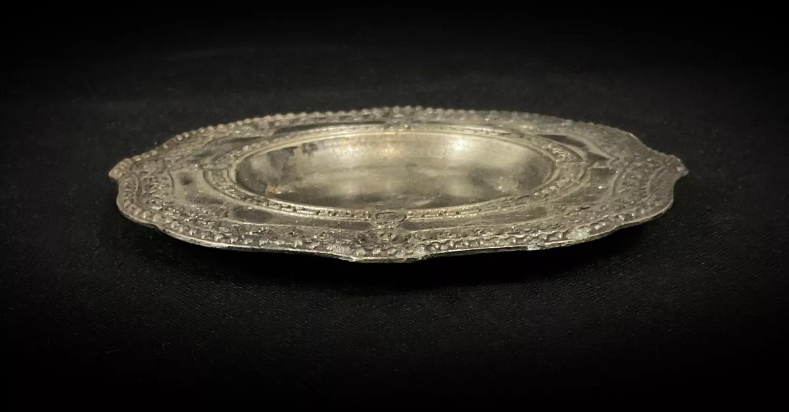 This vintage 20th-century pewter ashtray, engraved with 
