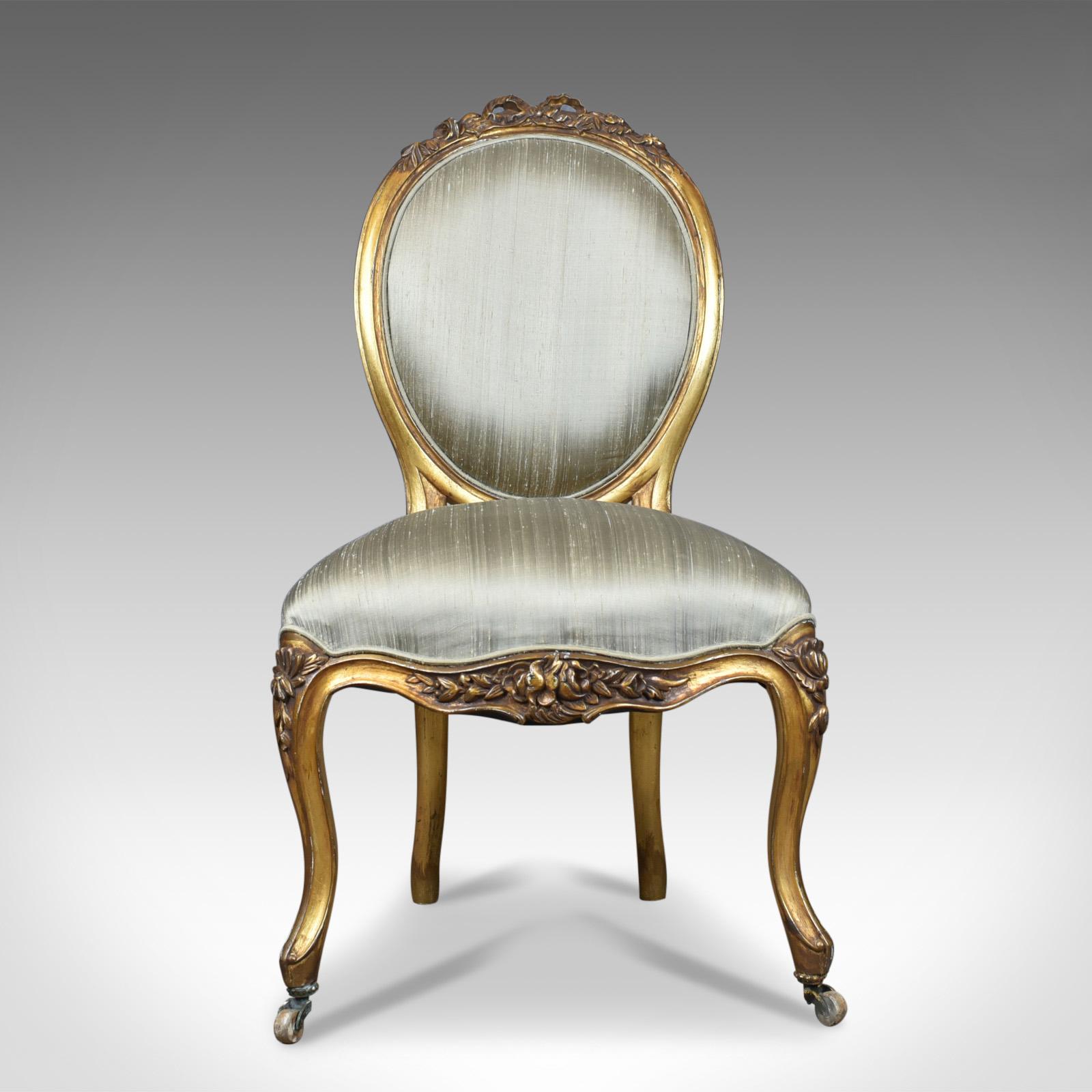 This is a vintage 20th century salon chair in the antique French taste, giltwood dating to circa 1970.

Attractive and comfortable salon chair
Elaborate giltwood frame
Decorated with ribbon and foliate detail

Cabriole legs to the front with
