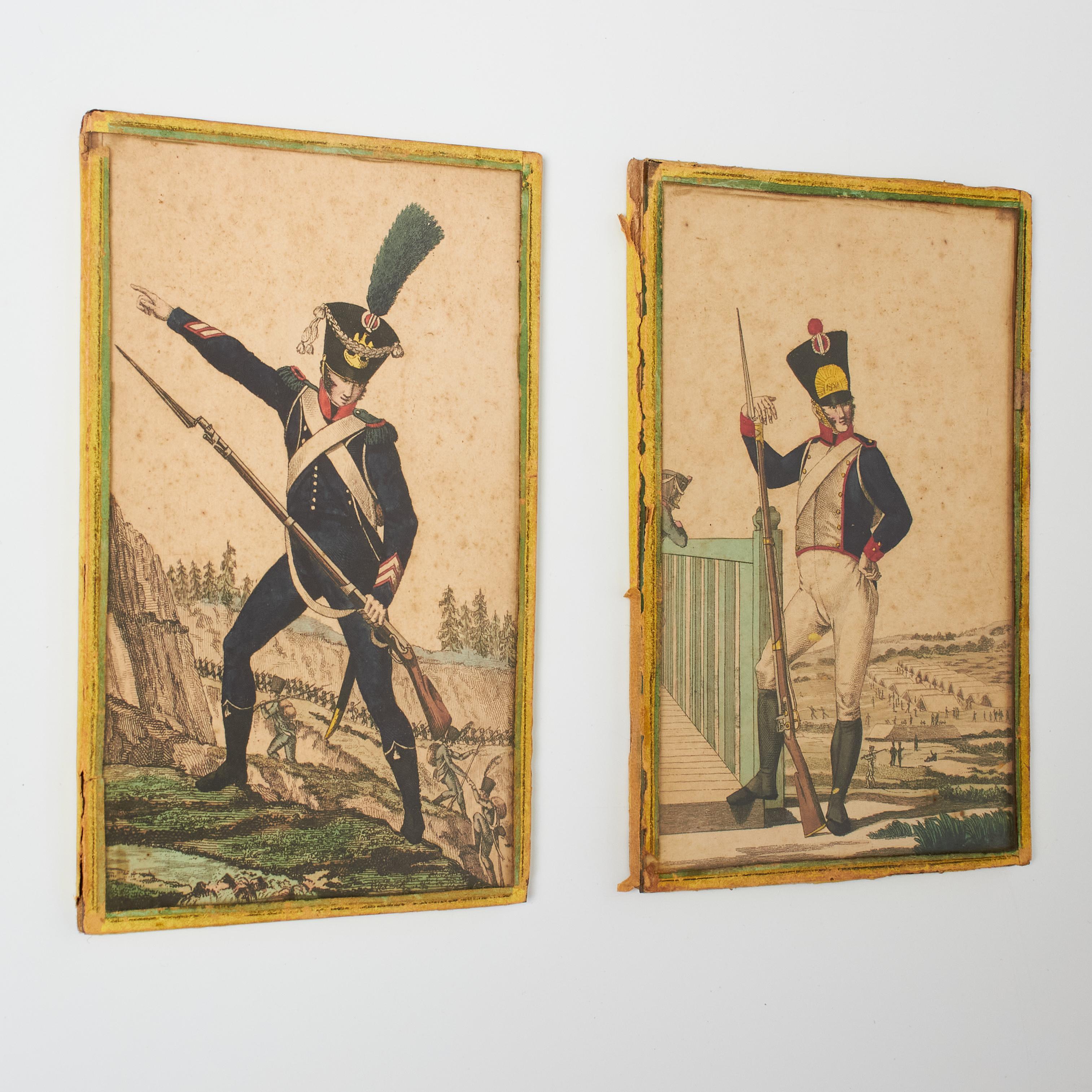 Explore military history through our enchanting pair of vintage 20th-century soldier engravings. Adorned with delicate colors, a beautiful patina, and framed in light yellow paper with protective glass, these artworks evoke the essence of a bygone