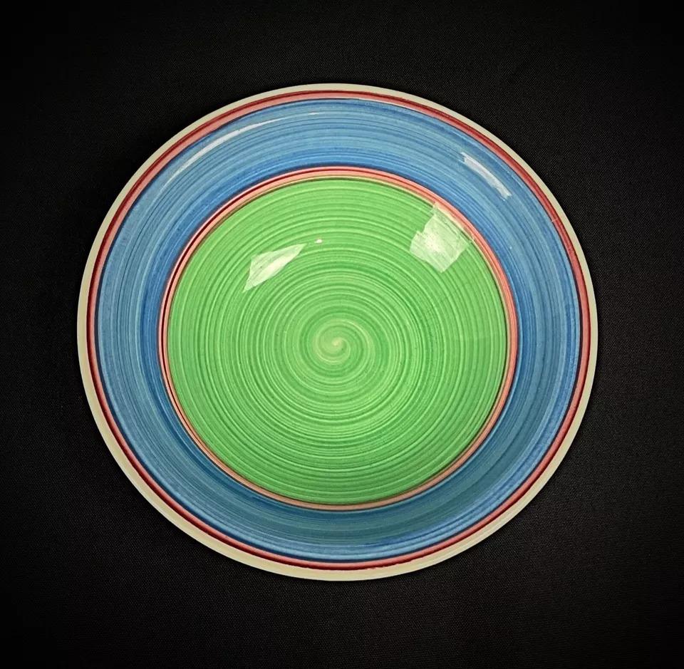 This vintage 20th-century ceramic catchall dish features an eye-catching spiral design in shades of blue and green, perfect as a decorative piece or for holding small items.

Condition: Good vintage condition. One small visible crack (see photos),