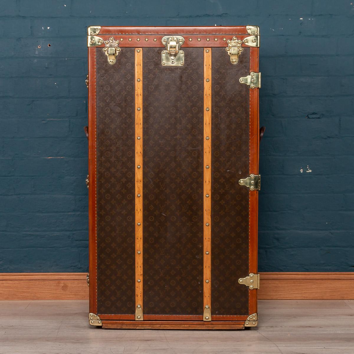 An extremely rare and unusual Louis Vuitton wardrobe trunk, made in France, circa 1950s-1960s. What differentiates this trunk from many of the other wardrobe trunk is the majestic proportions and the opening mechanism allowing the user to access the