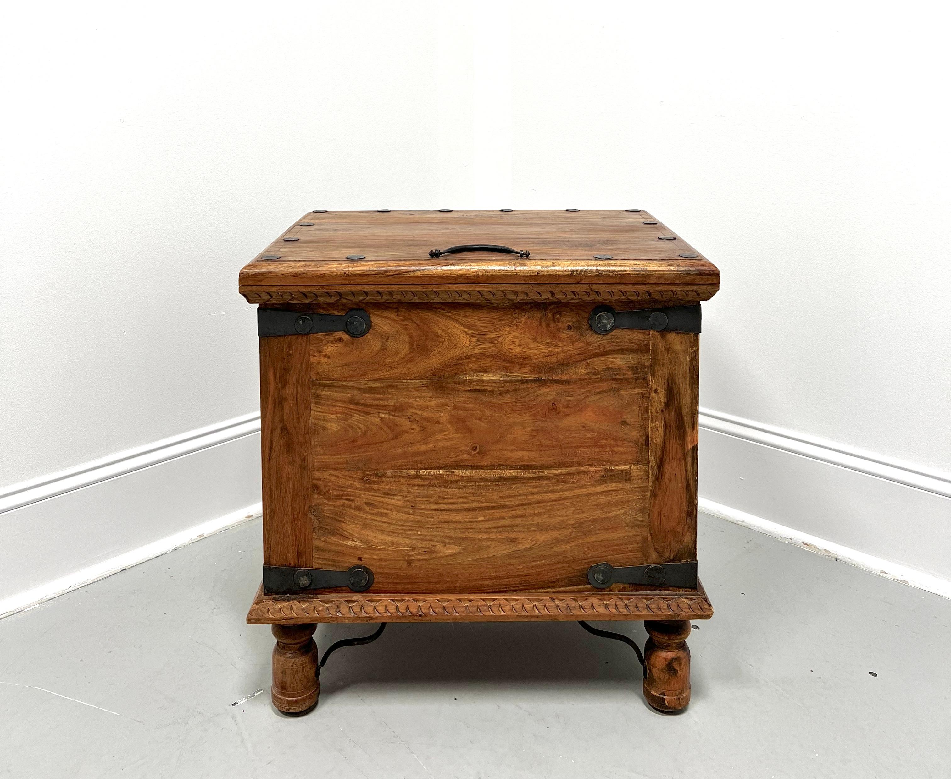 A Rustic style decorative storage trunk on legs or accent table, unbranded. Solid hardwood, lift up lid is on a hinge, bevel edge to the top, decorative metal accents, metal top & side handles, and elevated on turned round legs with curved metal