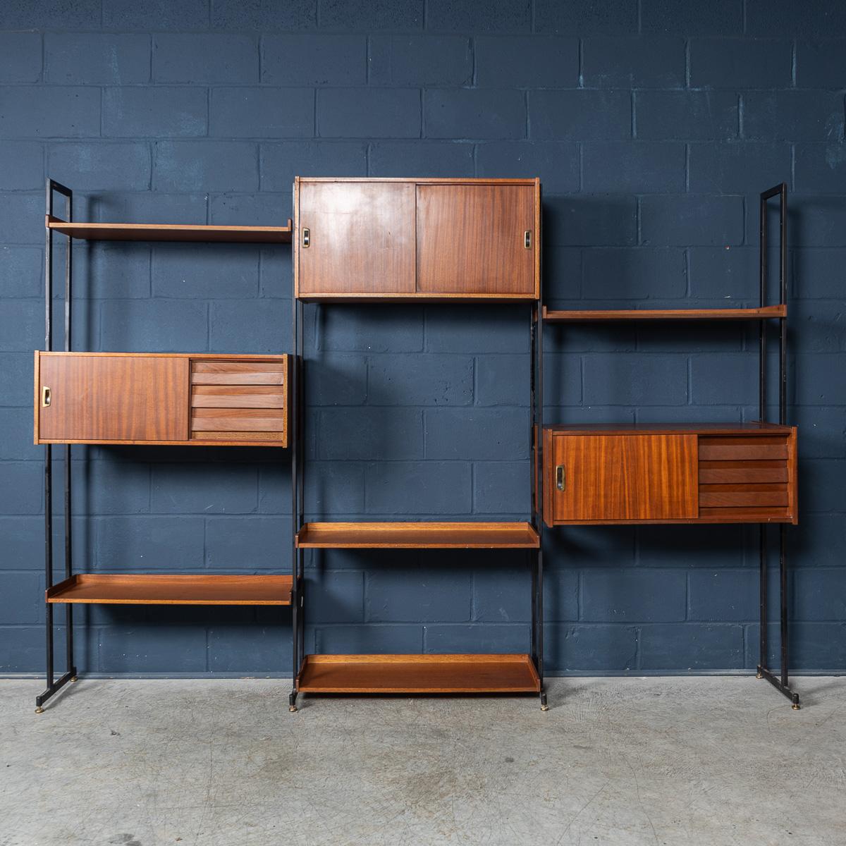 Introducing a wonderful piece of Italian design history, this is an exquisite mid-century modern bookcase from the 1960s. Crafted with attention to detail, this modular bookcase is made out of teak veneer and features three cabinets with sleek
