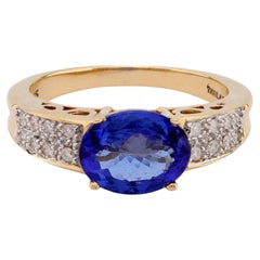 14k Gelbgoldring mit 2,10 Karat ovalem Tansanit im Ovalschliff und Diamanten