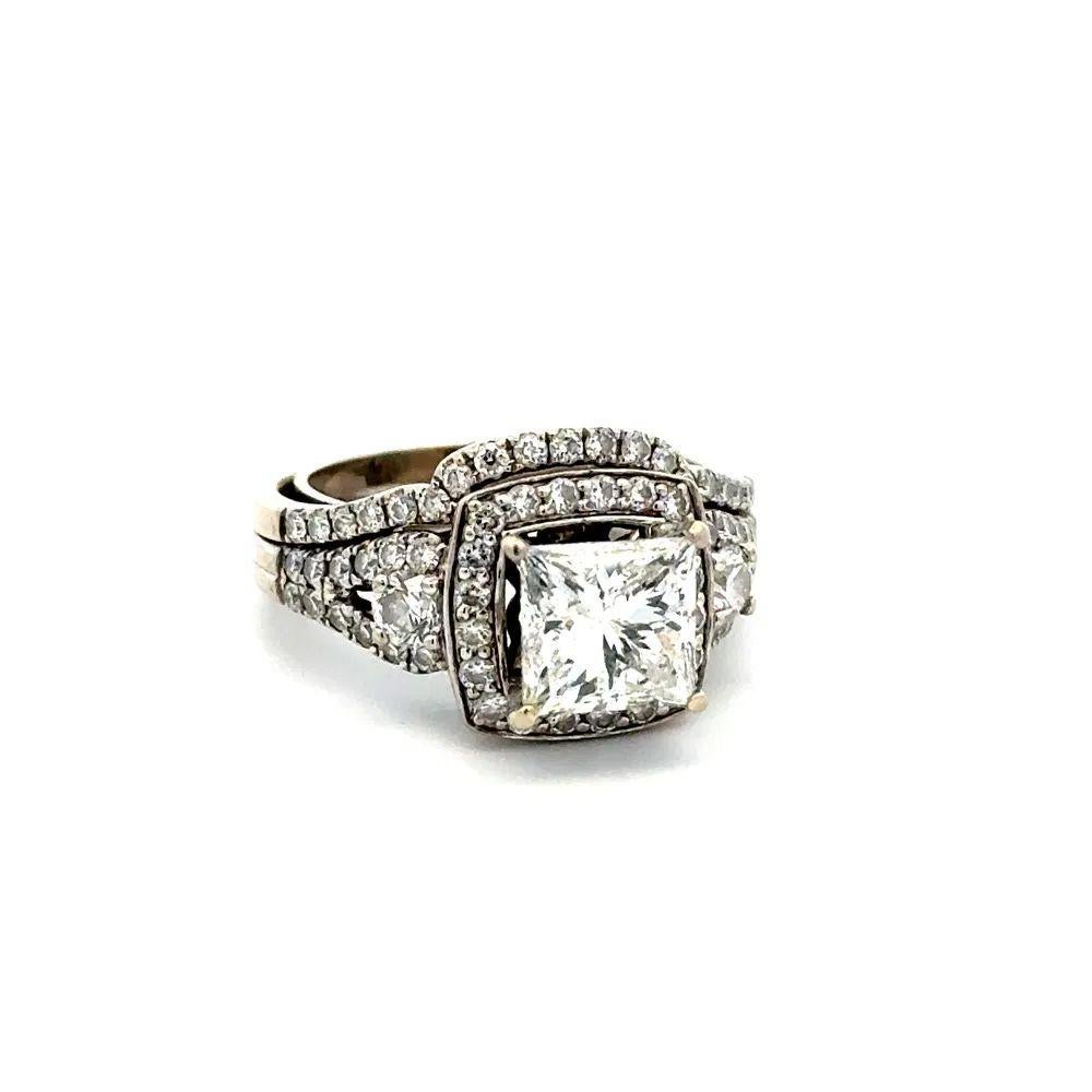 Simply Beautiful! 2.10 Carat Princess Cut GSI Diamond and 0.45tcw Round Brilliant Cut Gold Solitaire Ring. Centering a Princess Cut GSI Diamond, weighing approx. 2.10 Carat. Surrounded by RBC Diamonds, approx. 0.45tcw. Hand crafted 14K White Gold