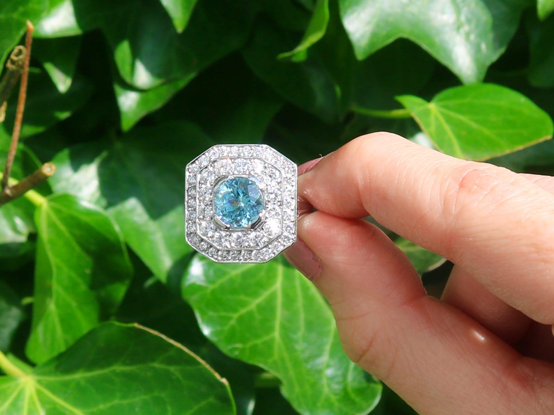A fine and impressive vintage 2.11 carat aquamarine, 2.22 carat diamond and 18 karat white gold dress ring; part of our diverse antique jewelry and estate jewelry collections.

This stunning, fine and impressive vintage aquamarine ring has been