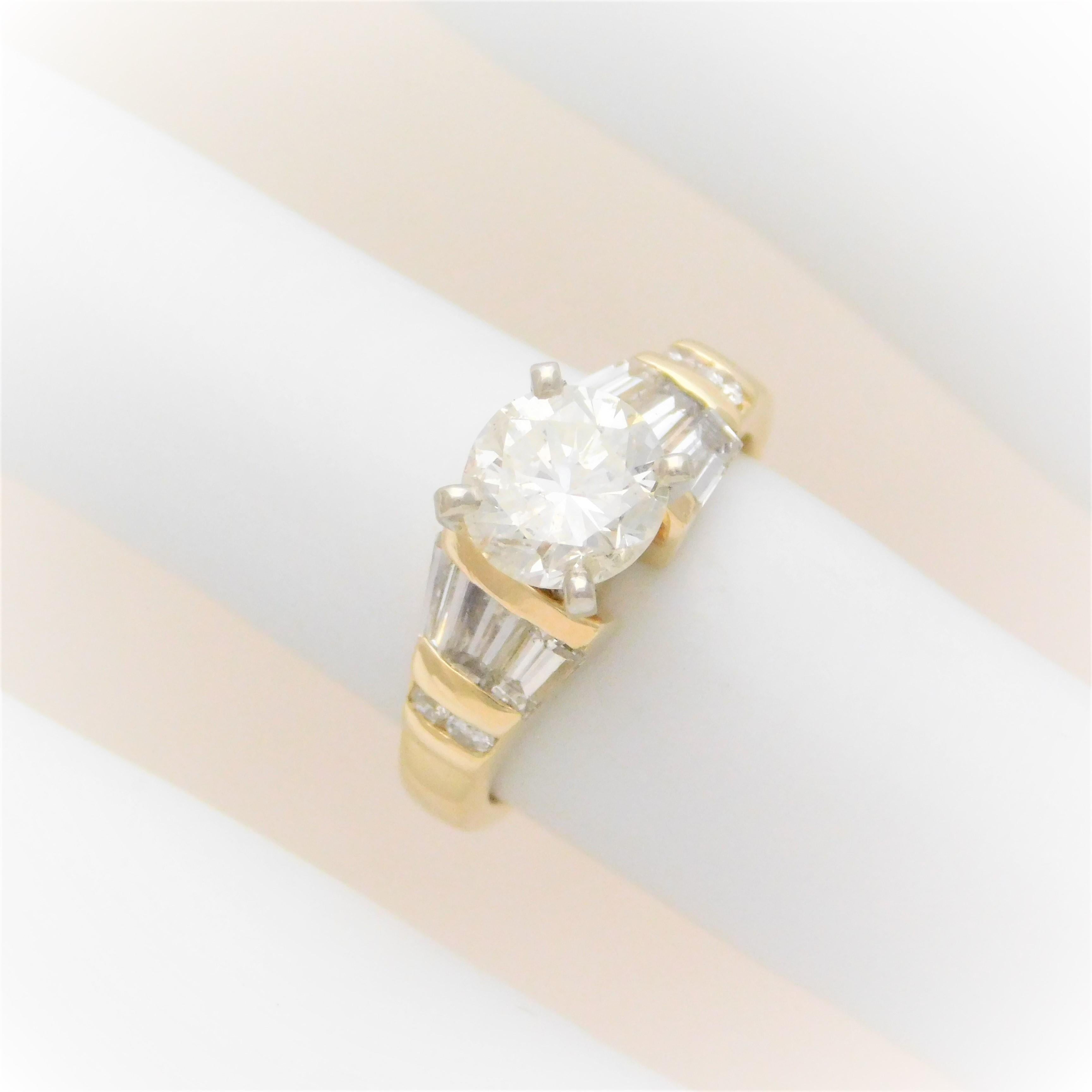 From a Southern estate.  Circa 1990.  This engagement style ring has been crafted in solid 14k yellow gold with a white gold head.  It has been adorned with a lovely 1.32ct round brilliant-cut natural diamond as its miraculous center stone.  This