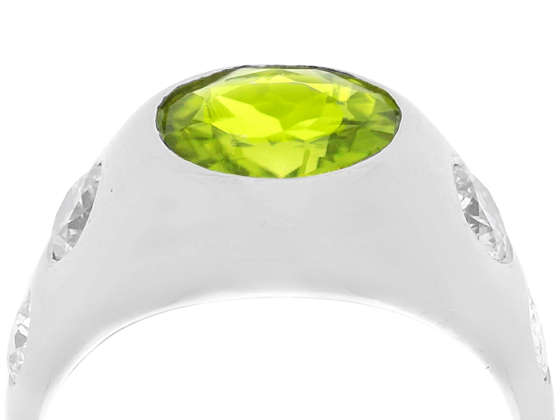 A stunning, fine and impressive vintage 2.15 carat peridot and 0.70 carat diamond, platinum dress ring; part of our diverse gemstone jewellery and estate jewelry collections

This stunning, fine and impressive vintage ring has been crafted in