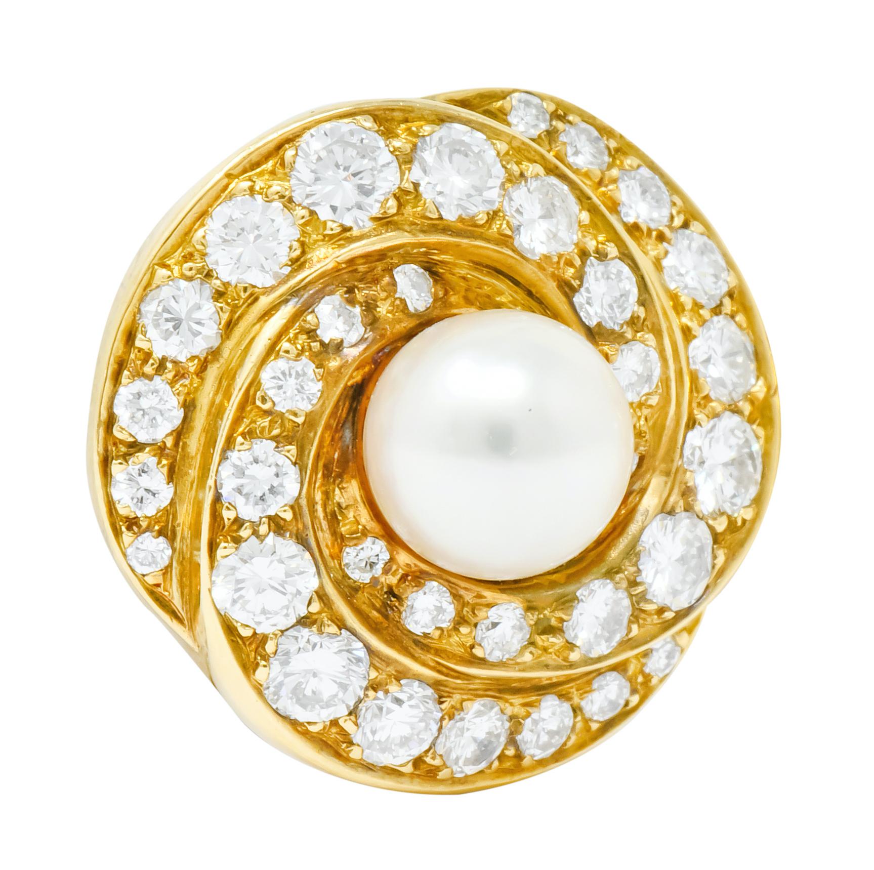 Each centering a round, cultured button pearl measuring approximately 6.8 mm, cream in body color with rose overtones and excellent luster

Surrounded by round brilliant cut diamonds weighing approximately 2.15 carats total, G to I color and VS