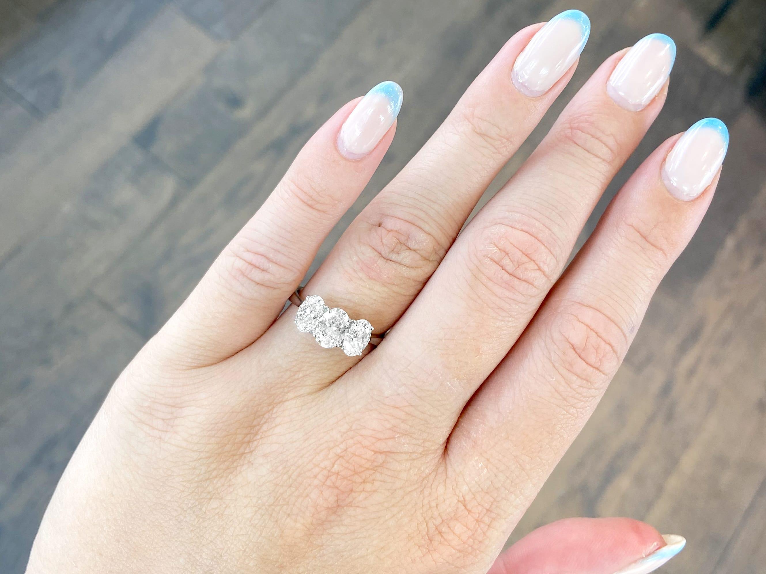 Oval Cut Vintage 2.19 Carat Diamond and White Gold Trilogy Engagement Ring For Sale