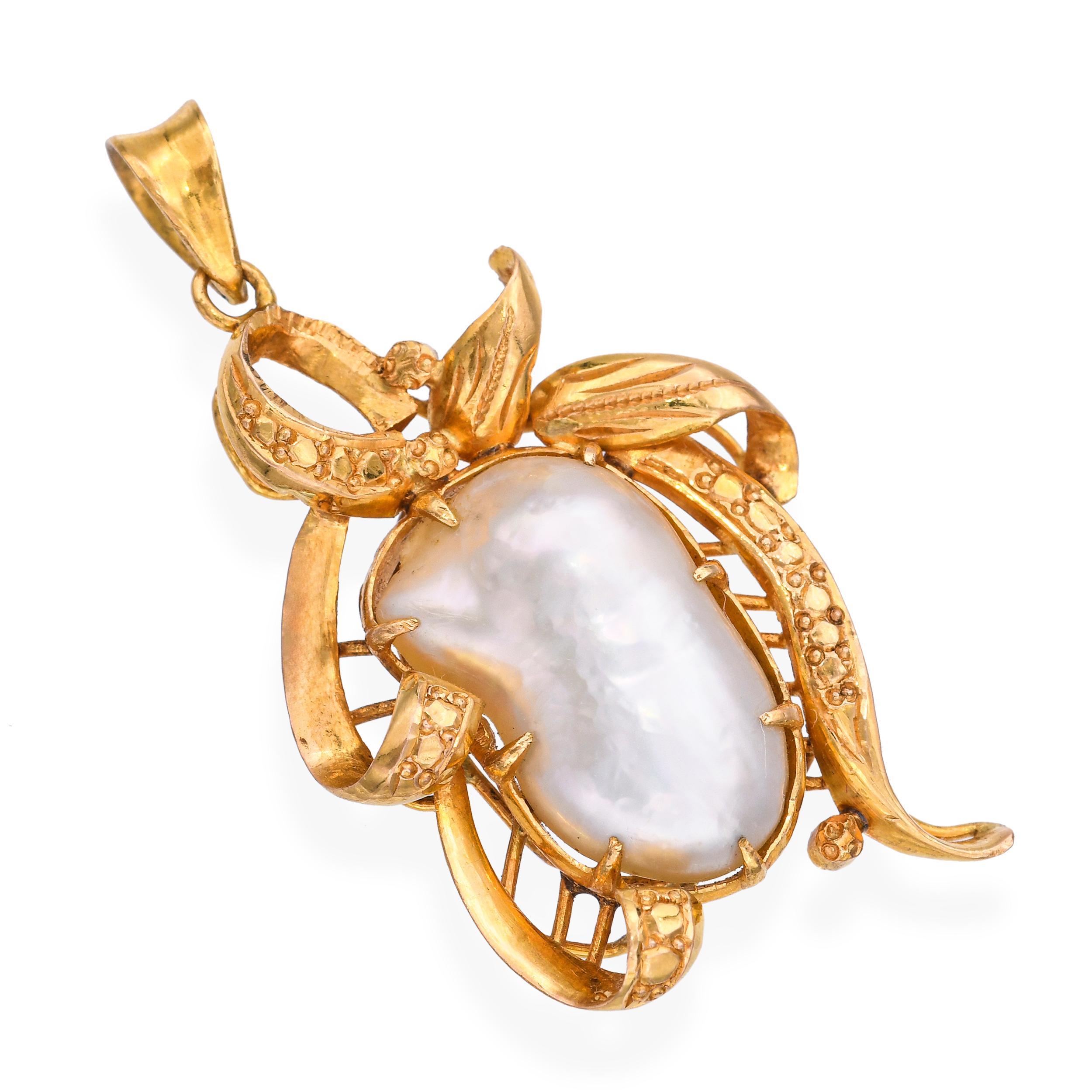 Vintage 21k yellow gold pendant showcasing a lustrous baroque pearl with organic, freeform shape and rich natural iridescence. The deep gold hue of the high-purity 21k setting beautifully complements the pearl’s creamy tones, creating an elegant and