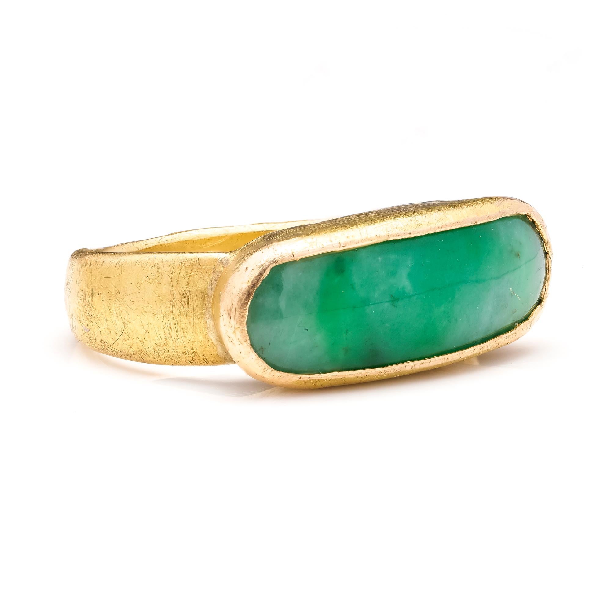 Vintage 21kt. gold men’s ring with elongated jade.
Tested positive for 21kt. gold.

Finger Size (UK) = N 1/2 (US) = 7 1/4 (EU) = 56
Ring size: 2.6 x 2.4 x 0.9 cm 
Weight: 11.00 grams

Condition: The ring is pre-owned, minor signs of usage, good and
