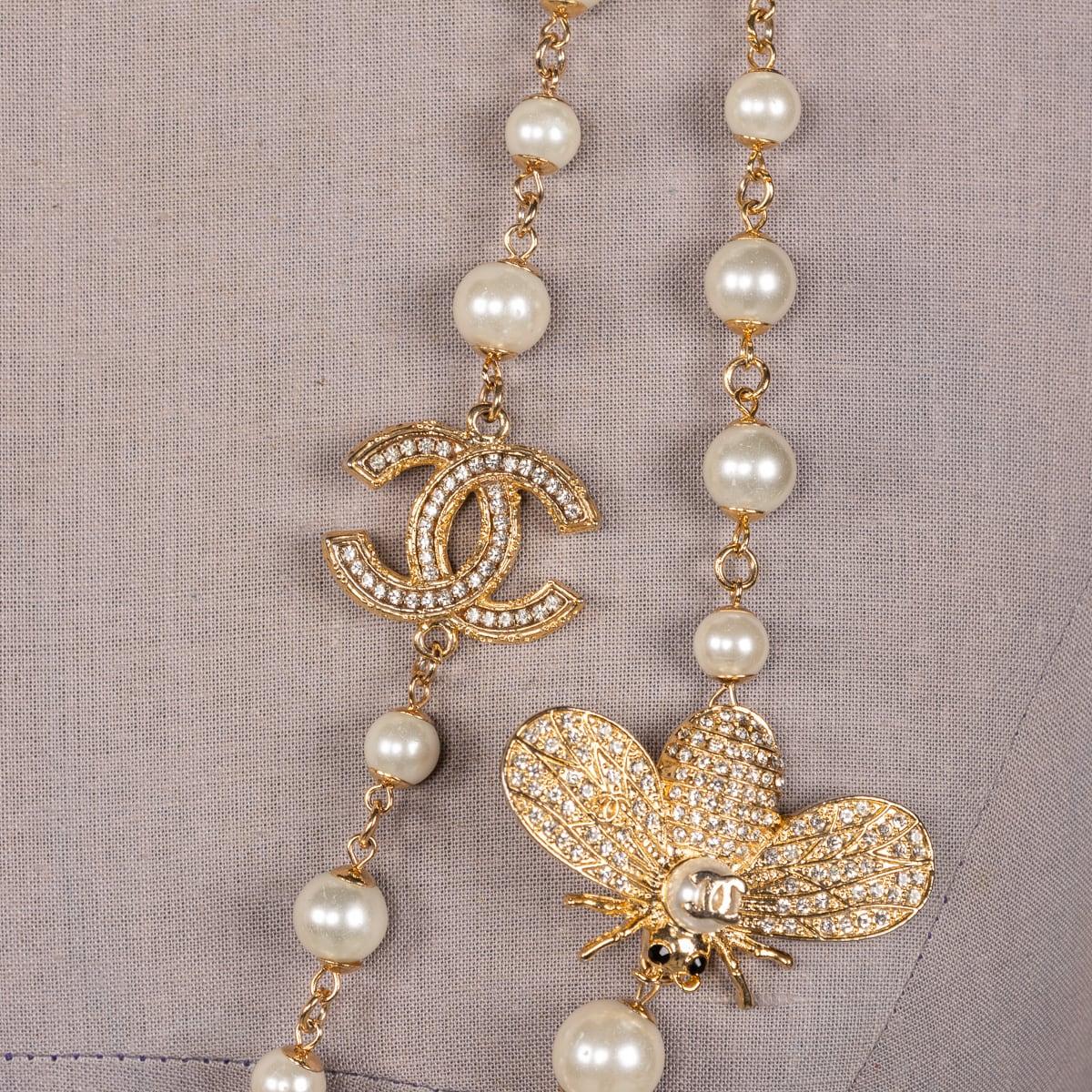 A stunning vintage Chanel necklace with a captivating arrangement of lustrous faux pearls, beautifully interspersed with elegant accents of gold metal. The allure of the pearls, combined with stylish gold elements, creates an undeniably