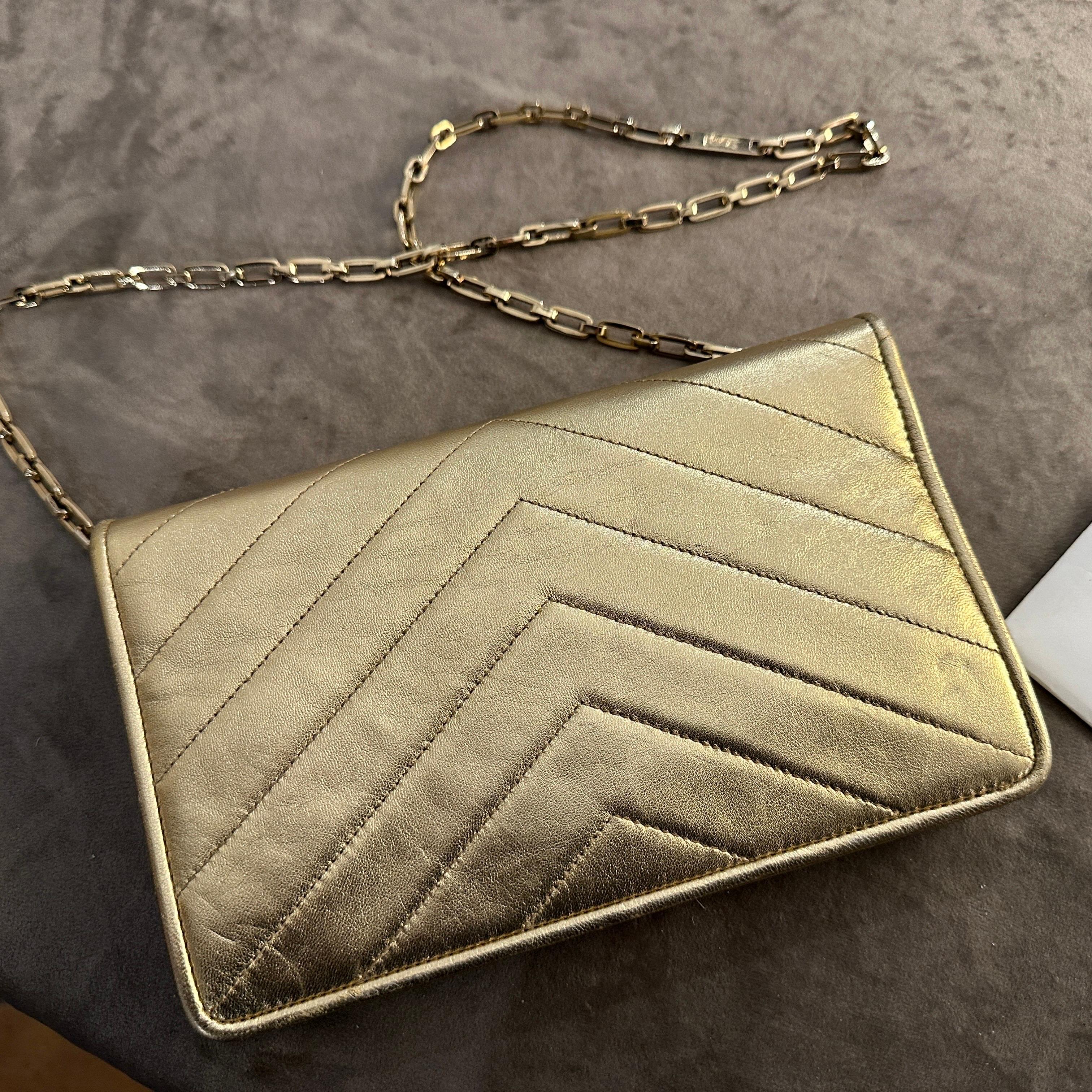 Women's Vintage 21st Century Gold Leather Clutch Bag by Yves Saint Laurent