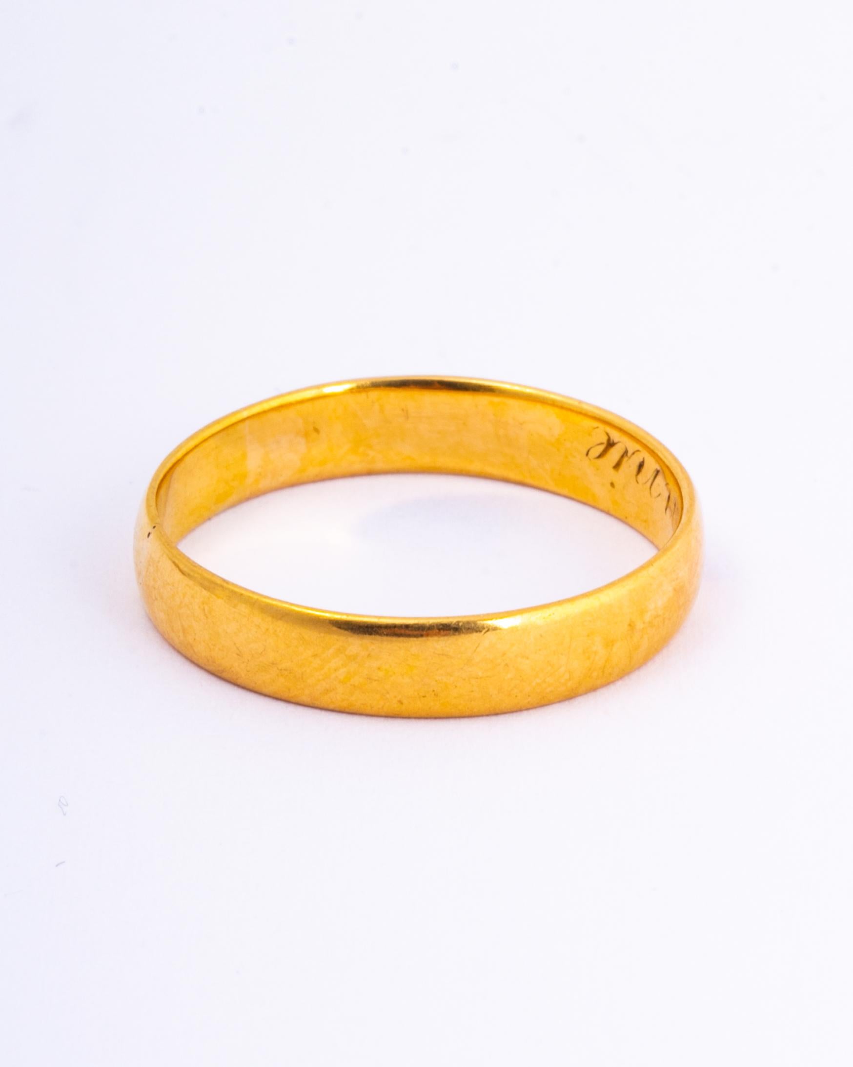 Glossy 22ct gold band perfect for a wedding band or just a simple everyday piece. The inside of this band has the names  'Henry-Annie' engraved into it.

Ring Size: V or 10 1/2 
Band Width: 4.5mm

Weight: 4.3g