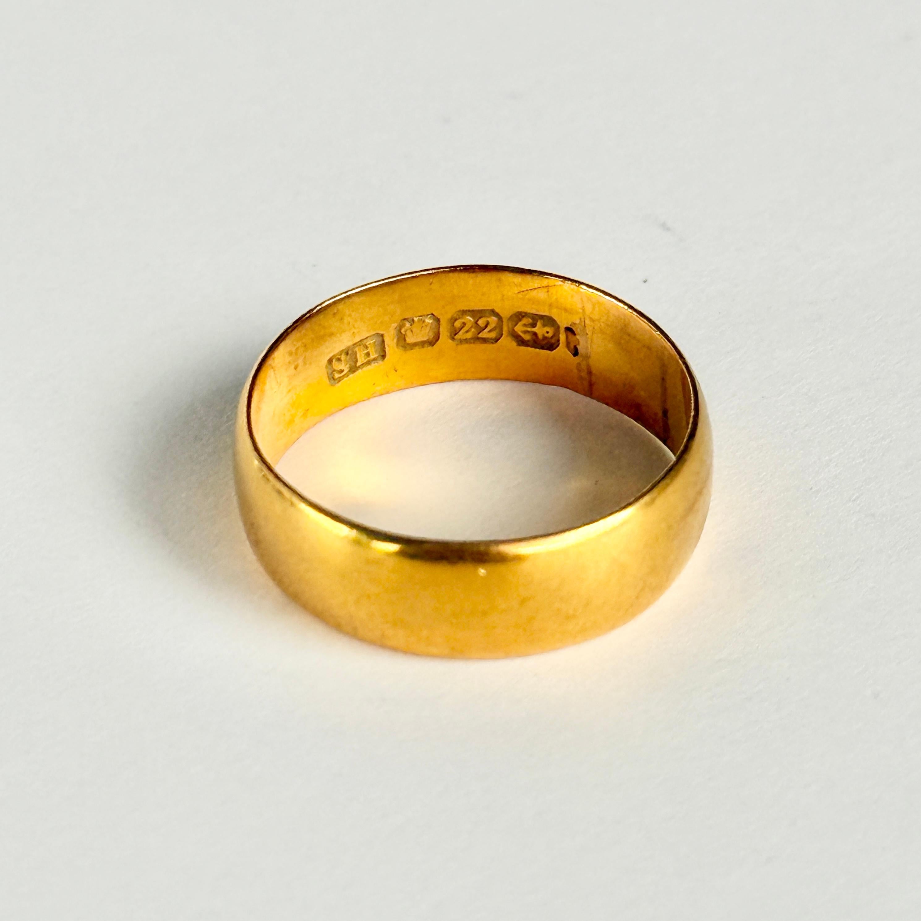Glossy 22ct gold band, made in Birmingham England. Perfect for a wedding band or just a simple everyday piece. Hallmarked Birmingham 1975.

Ring Size: L or 5 3/4
Band Width: 6mm
Height off finger: 1mm

Weight: 3.9g