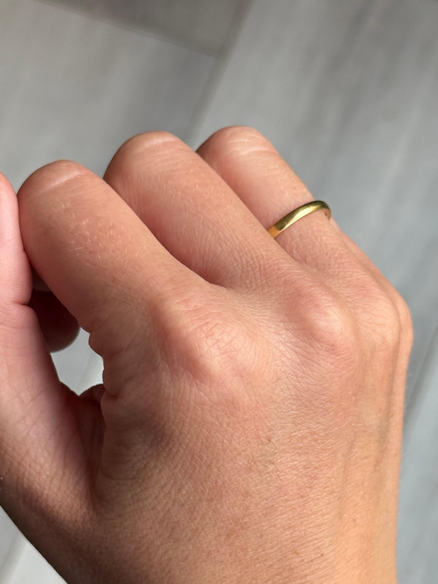 Glossy 22ct gold band. Perfect for a wedding band or just a simple everyday piece.  

Ring Size: K 1/2 or 5 1/2 
Band Width: 2mm
Height off finger: 1mm

Weight: 2.1g