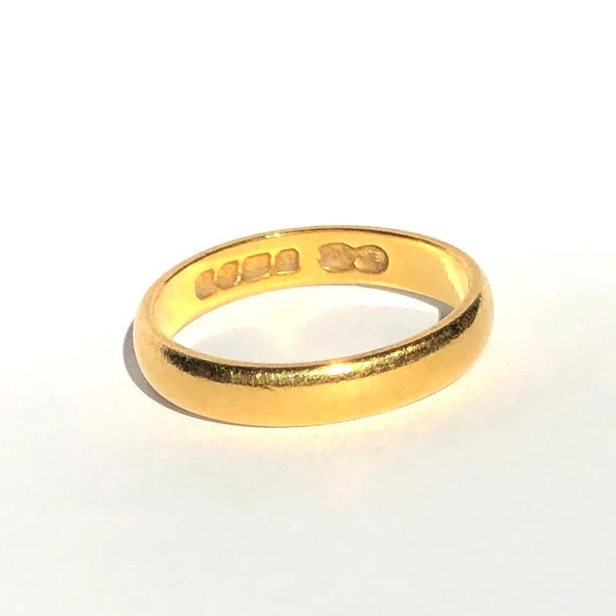 Simple gold bands make the classic wedding band or can be worn as a stylish everyday wear ring to stack or wear alone. Modelled in 22ct Gold and made in Birmingham, England. 

Ring Size: L or 5 3/4
Band Width: 3.6mm 

Weight: 3.88g