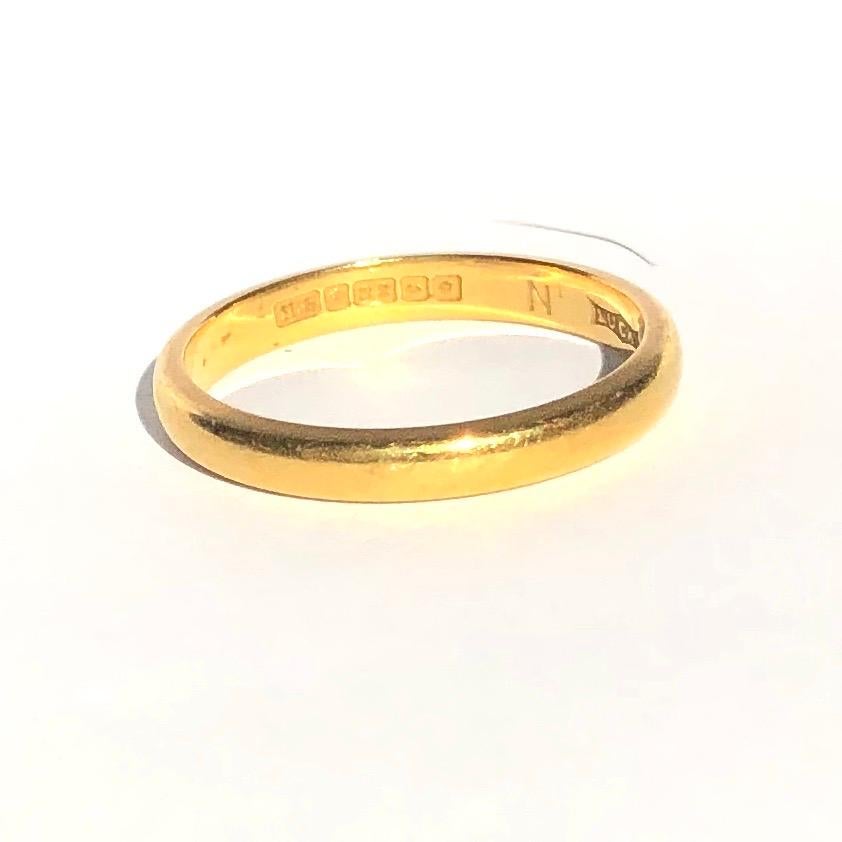 Simple gold bands make the classic wedding band or can be worn as a stylish everyday wear ring to stack or wear alone. Modelled in 22ct Gold and made in Birmingham, England. 

Ring Size: Q or 8 1/4
Band Width: 3.14mm 

Weight: 4.45g