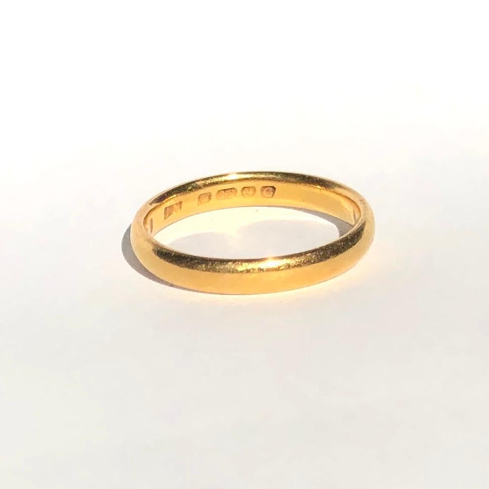 Simple gold bands make the classic wedding band or can be worn as a stylish everyday wear ring to stack or wear alone. Modelled in 22ct Gold and made in Birmingham, England. 

Ring Size: K or 5 1/2
Band Width: 2.8mm 

Weight: 3.17g