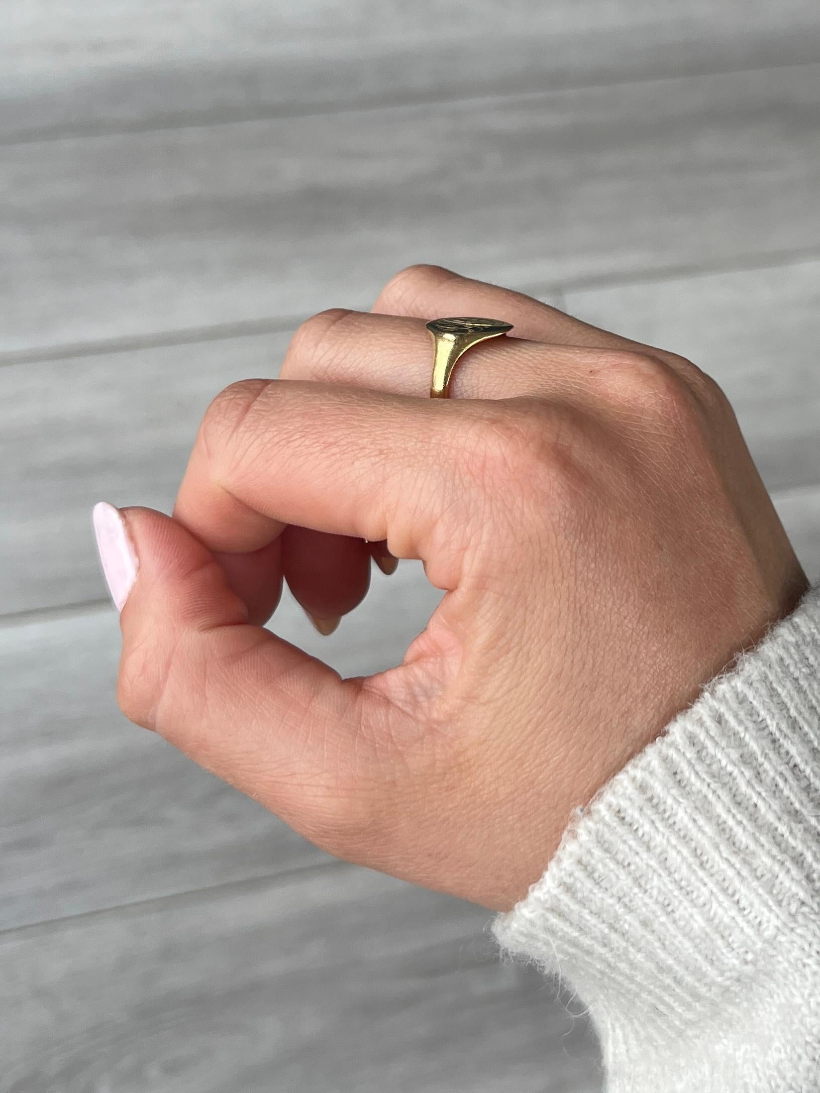 This sweet signet is modelled in 22ct gold. The colour of the ring is bright yellow gold. Initials 'PAF' engraved onto the face.

Ring Size: N or 6 3/4 
Face Diameter: 14x9mm 

Weight: 3.8g