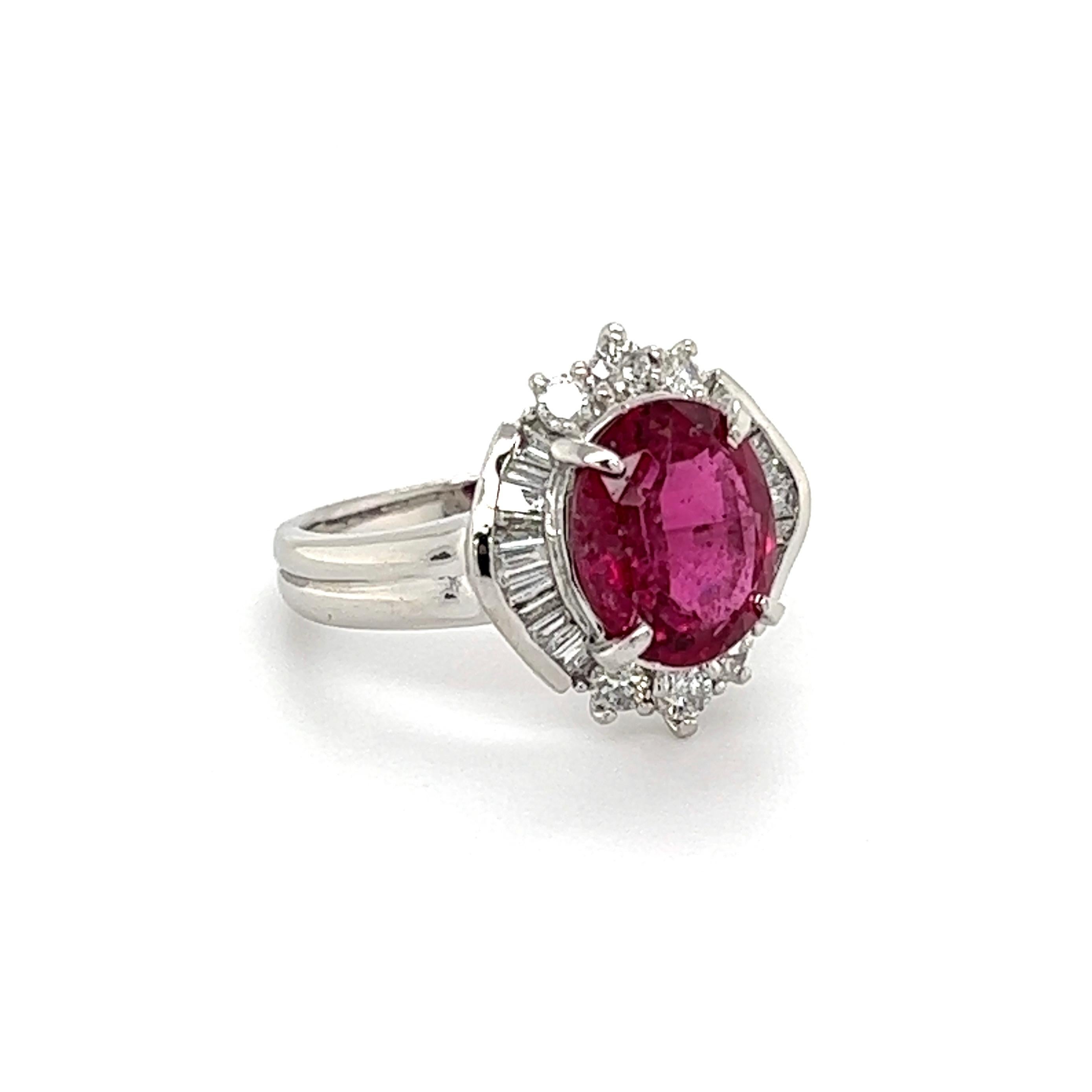Simply Beautiful! Finely crafted Rubelite Tourmaline and Diamond Cocktail Ring, centering a securely nestled Rubelite Tourmaline, weighing approx. 2.23 Carat, surrounded by round and baguette Diamonds, weighing approx. 0.46tcw. Hand crafted Platinum