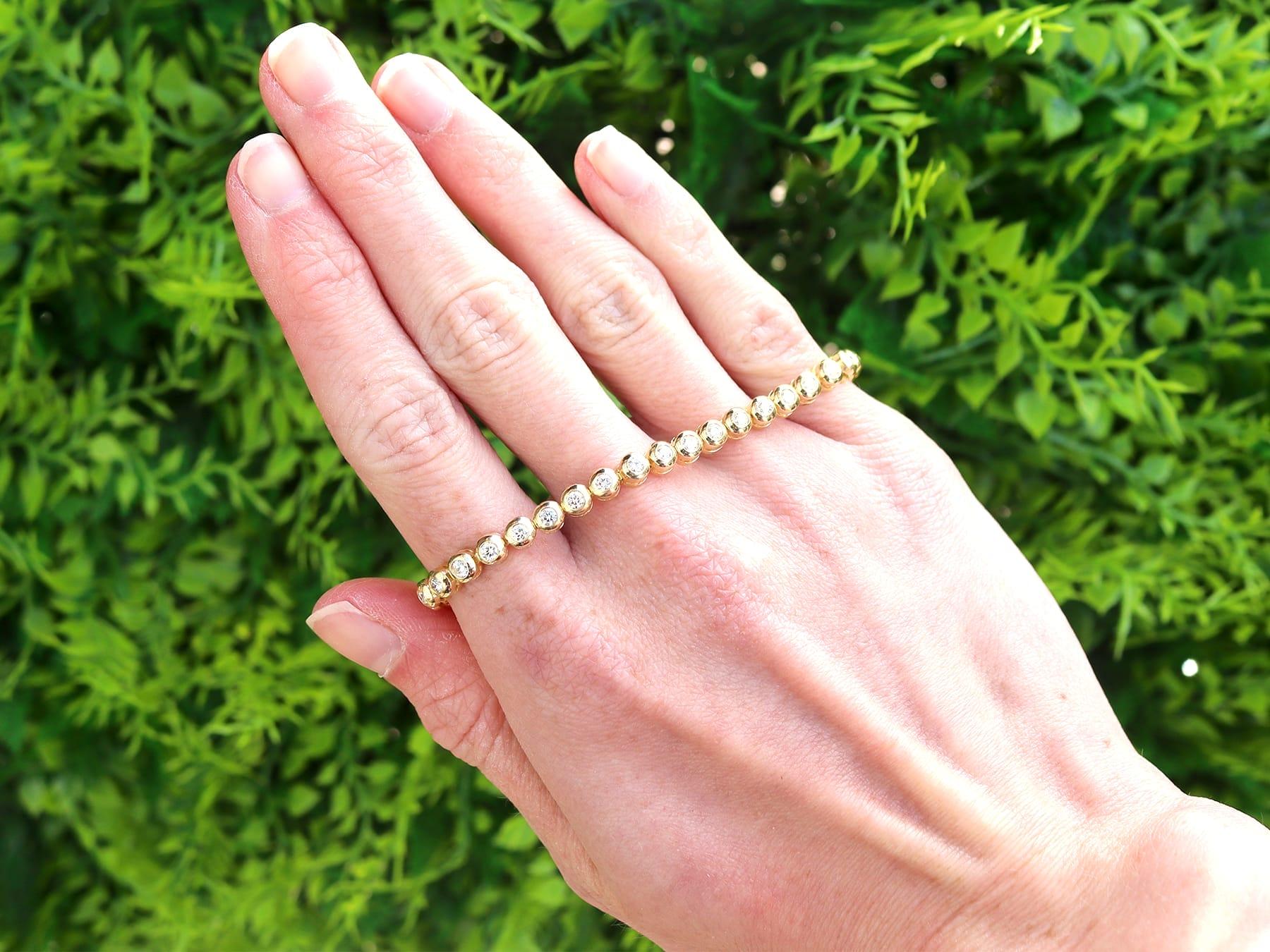 A fine and impressive vintage 2.25 carat diamond and 18 karat yellow gold tennis bracelet; part of our diverse diamond jewellery collection.

This fine and impressive diamond tennis bracelet has been crafted in 18k yellow gold.

The diamond bracelet