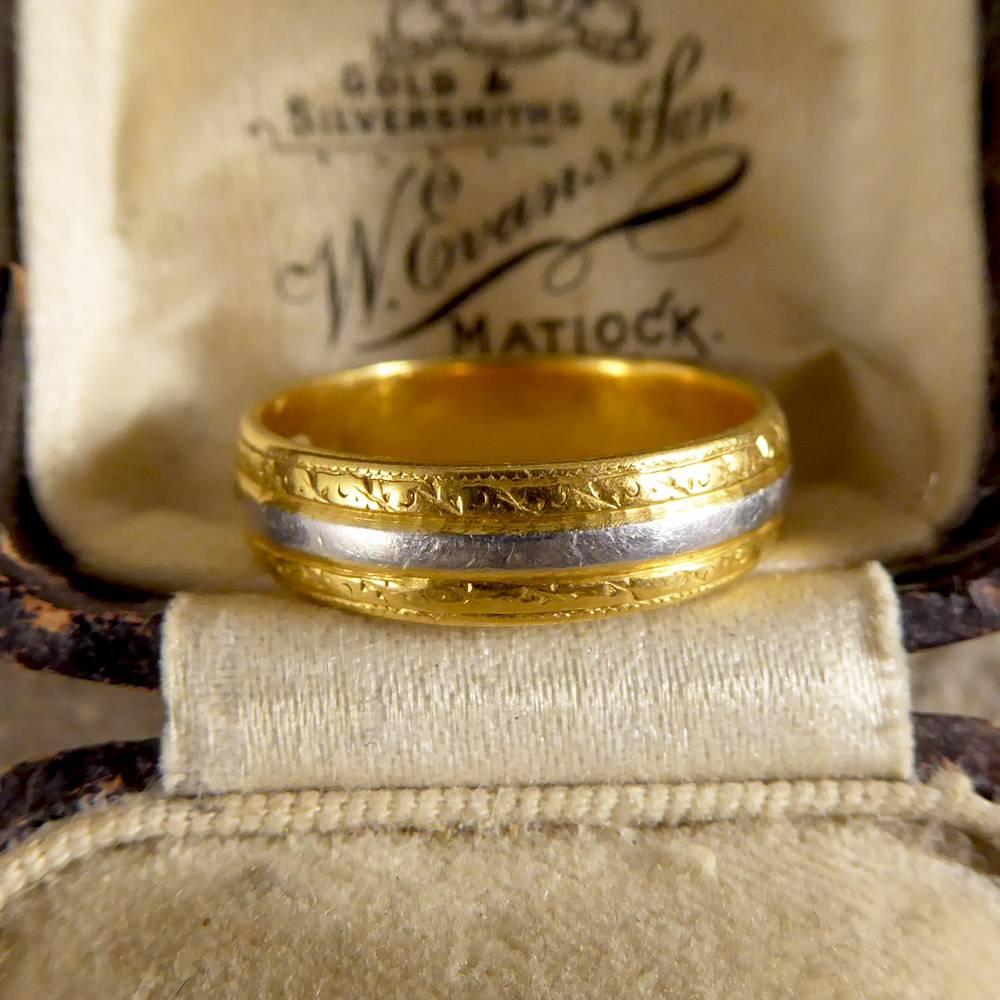 This exquisite engraved Wedding Band dates to 1958. It has been crafted in 22ct Yellow Gold with a Platinum central line, and looks divine on the finger!

Ring Size: UK N or US 6.75

Condition: Very Good, slightest signs of wear due to age and