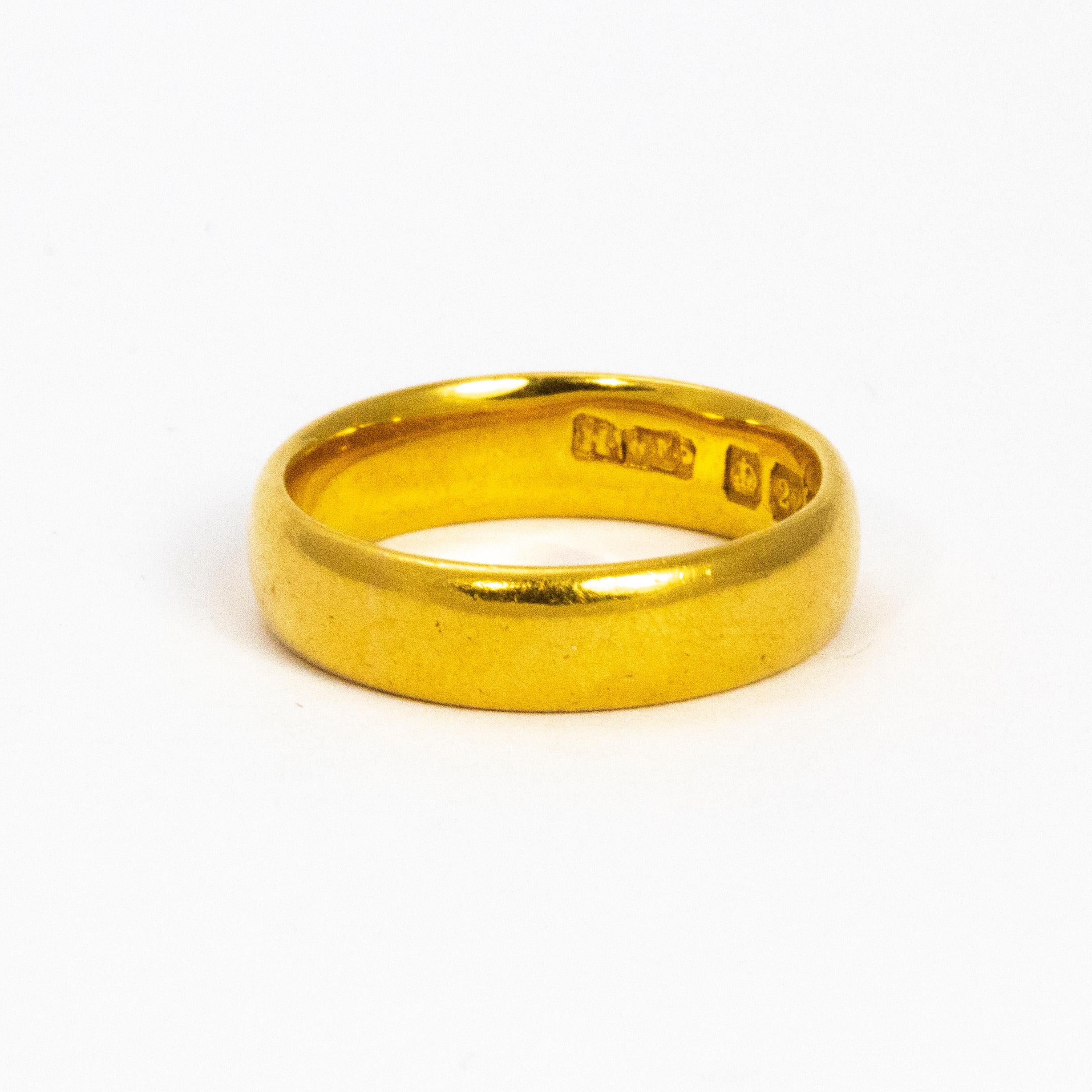 Never going out of fashion, this classic 22ct gold band measures approx 4mm wide and would make a perfect wedding band or a simple everyday ring.

Ring Size: J or 4 3/4