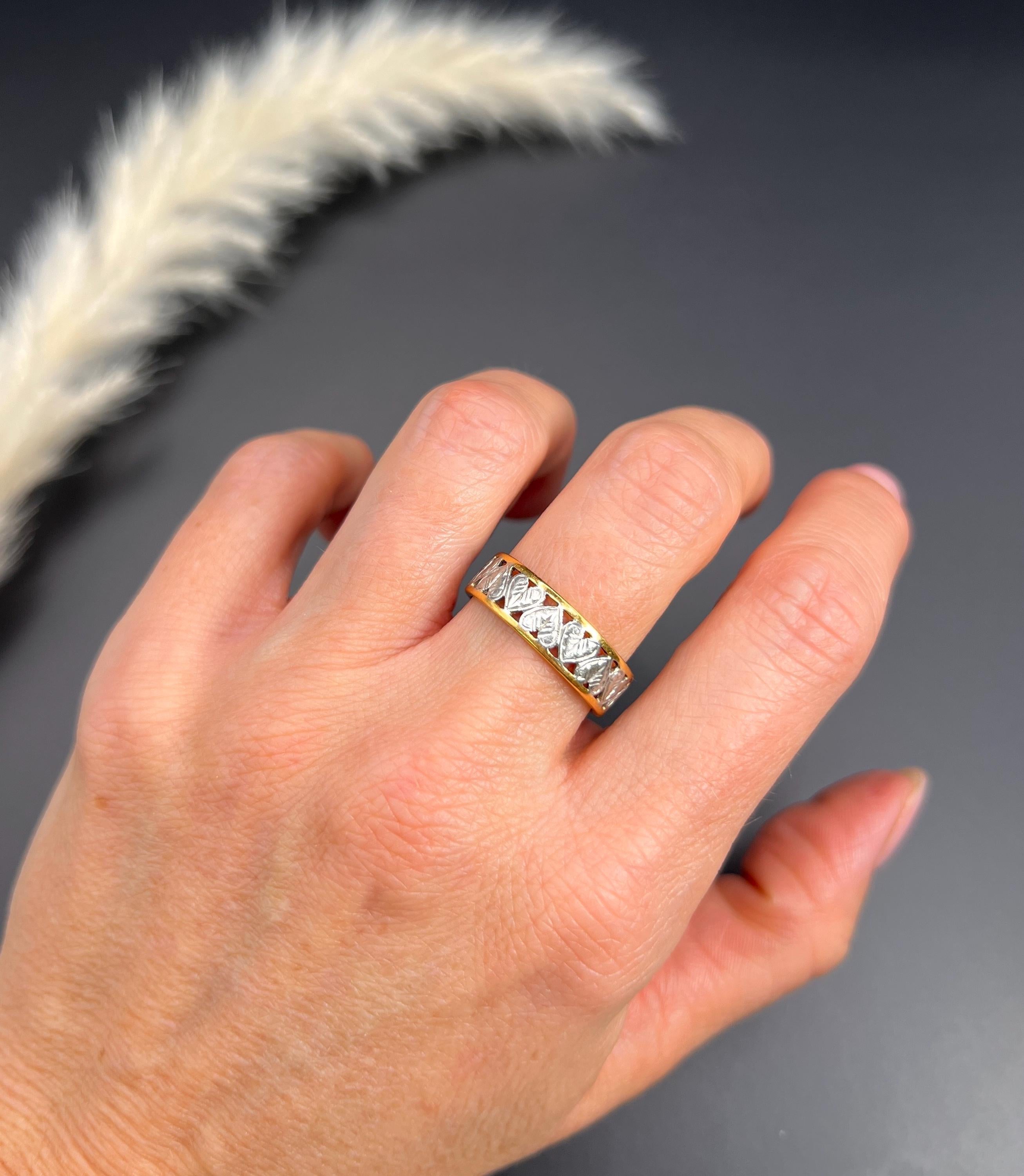 Vintage Heart Band

22ct Gold & Platinum Stamped

Circa 1940s

Discover the charm of the past with this exquisite 1940s Vintage Heart Band, a true testament to vintage elegance. At the centre, you'll find beautifully detailed platinum hearts that