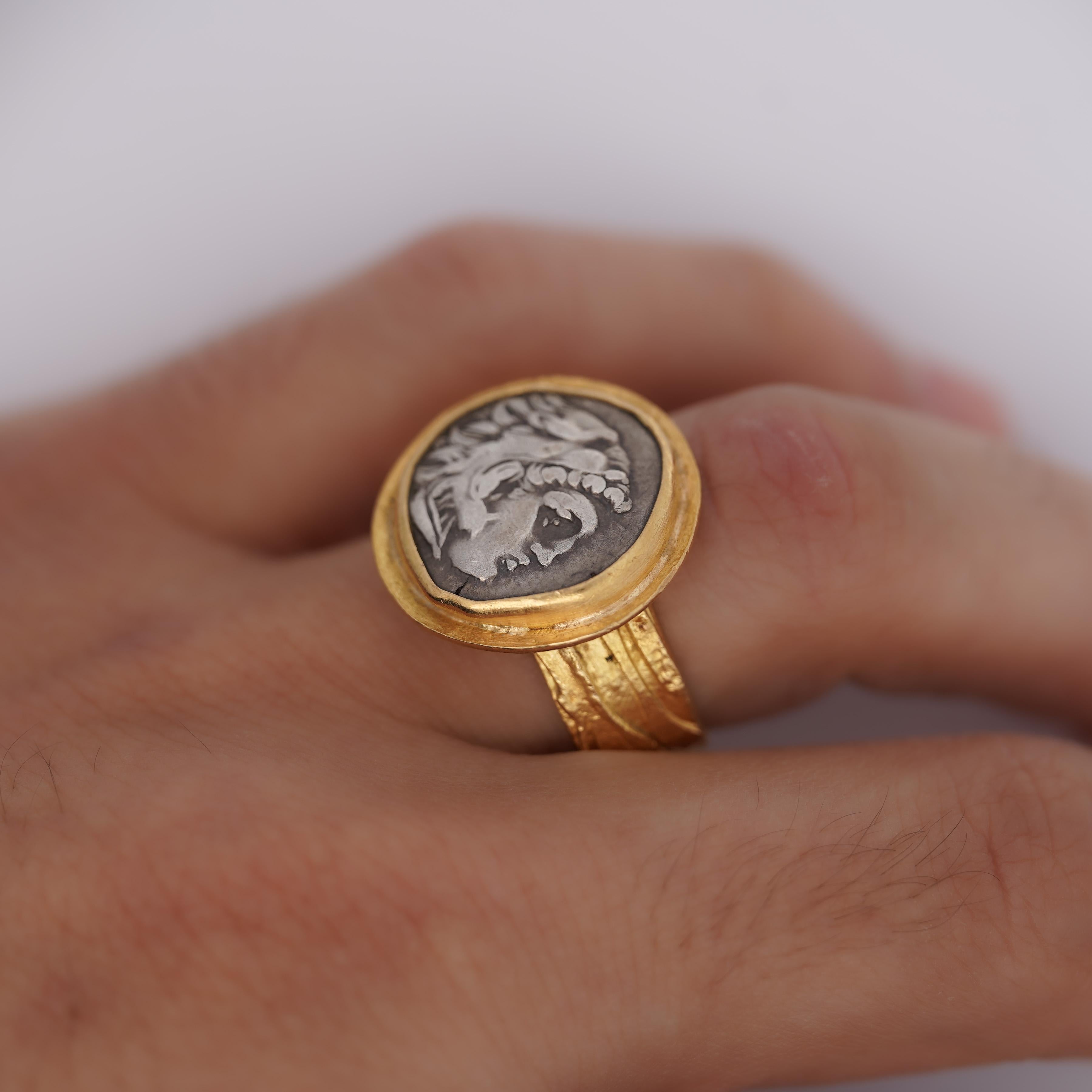 22K carved yellow gold ring weighing 20.3 grams, featuring a striking Alexander III the Great Roman coin, in ring size 9.75.

Alexander III The Great - Macedonian Kingdom 
(336-323 B.C.) 

Tetradrachm 

Head of Heracles r. Wearing lion skin headers