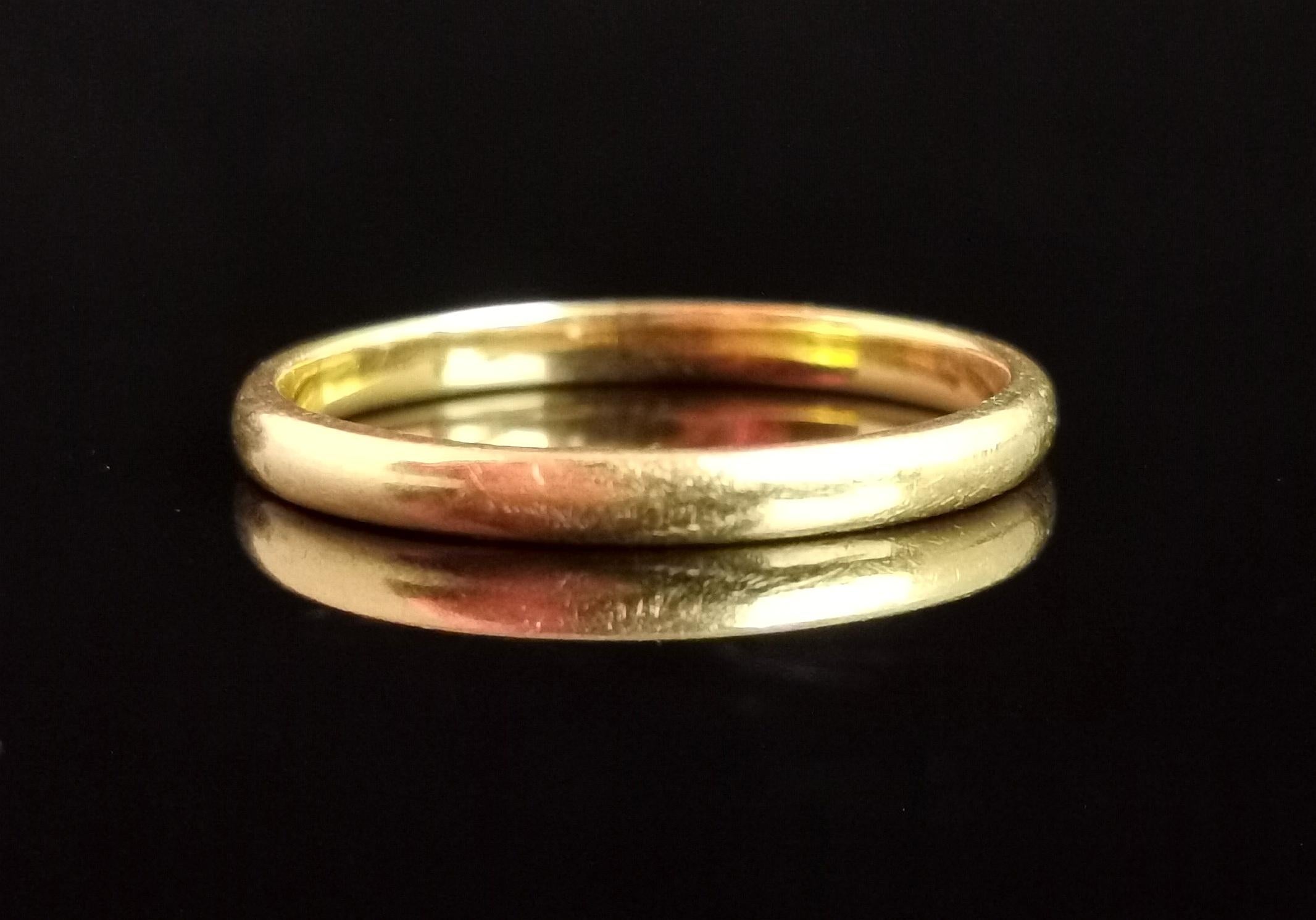 A gorgeous, Art Deco era 22kt gold band ring or wedding ring.

Rich, warm, buttery golden 22kt yellow gold, this lovely hue is only ever found on old gold and it is so rich and unique.

It has a very soft D profile and is a slim band, perfect for
