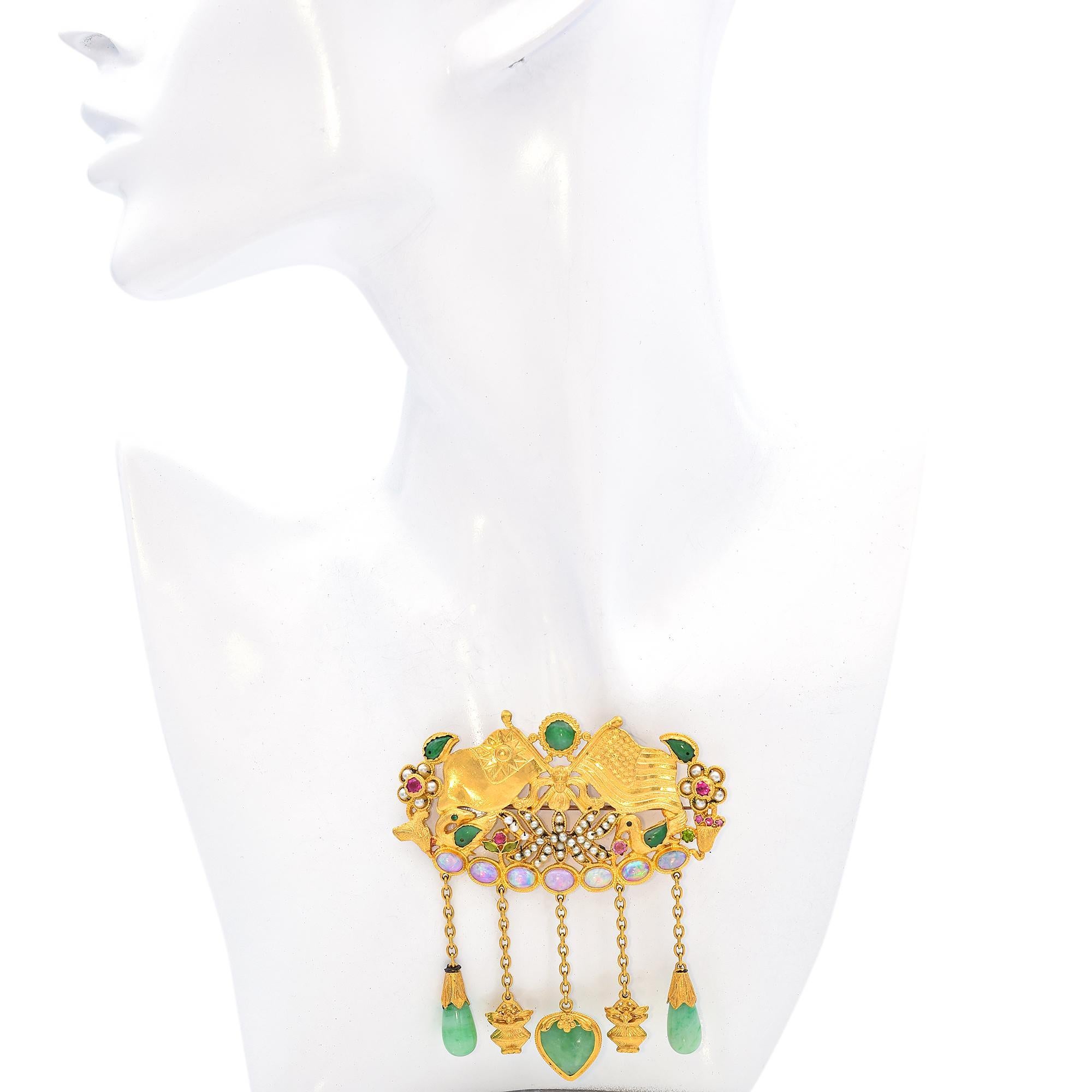 This stunning piece features vibrant green jade as the primary stone, complemented by vibrant opals and delicate pearls. The intricate design showcases Taiwan-USA flags, a swan motifs adorned with jade, and floral accents with pearl and colorful