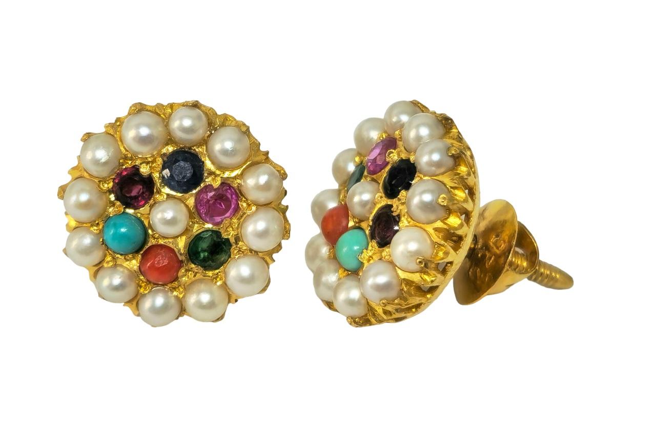 Adorn yourself with the exotic allure of these unique vintage earrings, crafted from radiant 22k yellow gold. Each earring features an enchanting array of gemstones including pearls, emeralds, rubies, blue sapphires, coral, pink sapphires, and